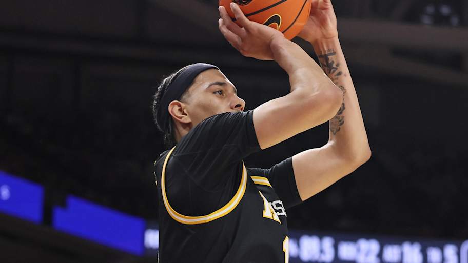 Missouri Tigers guard Trent Pierce (11) shoots a three point shot in the second half against the Arkansas Razorbacks 