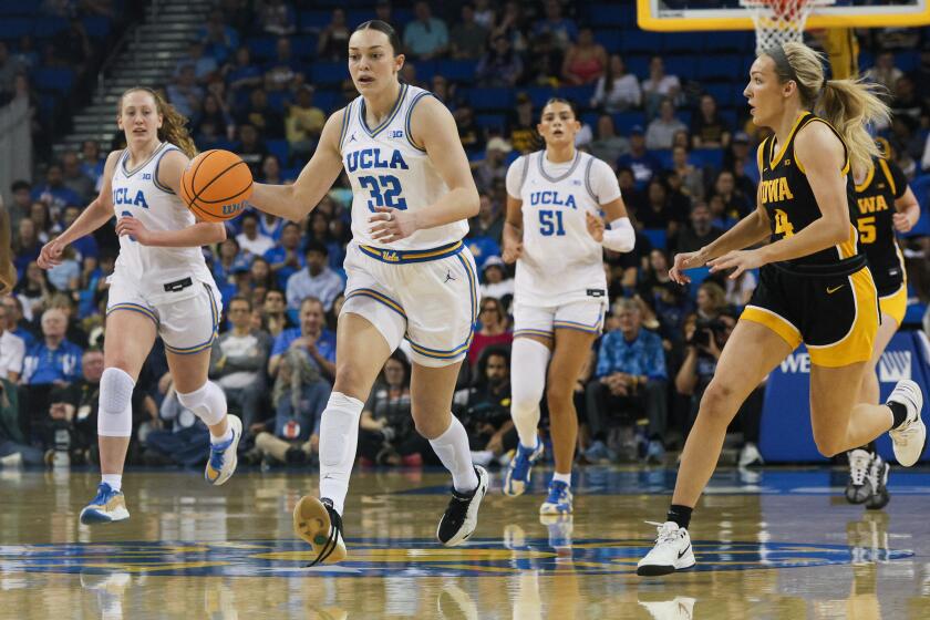 Los Angeles, CA - February 01: UCLA forward Angela Dugalic (32) dribbles down.