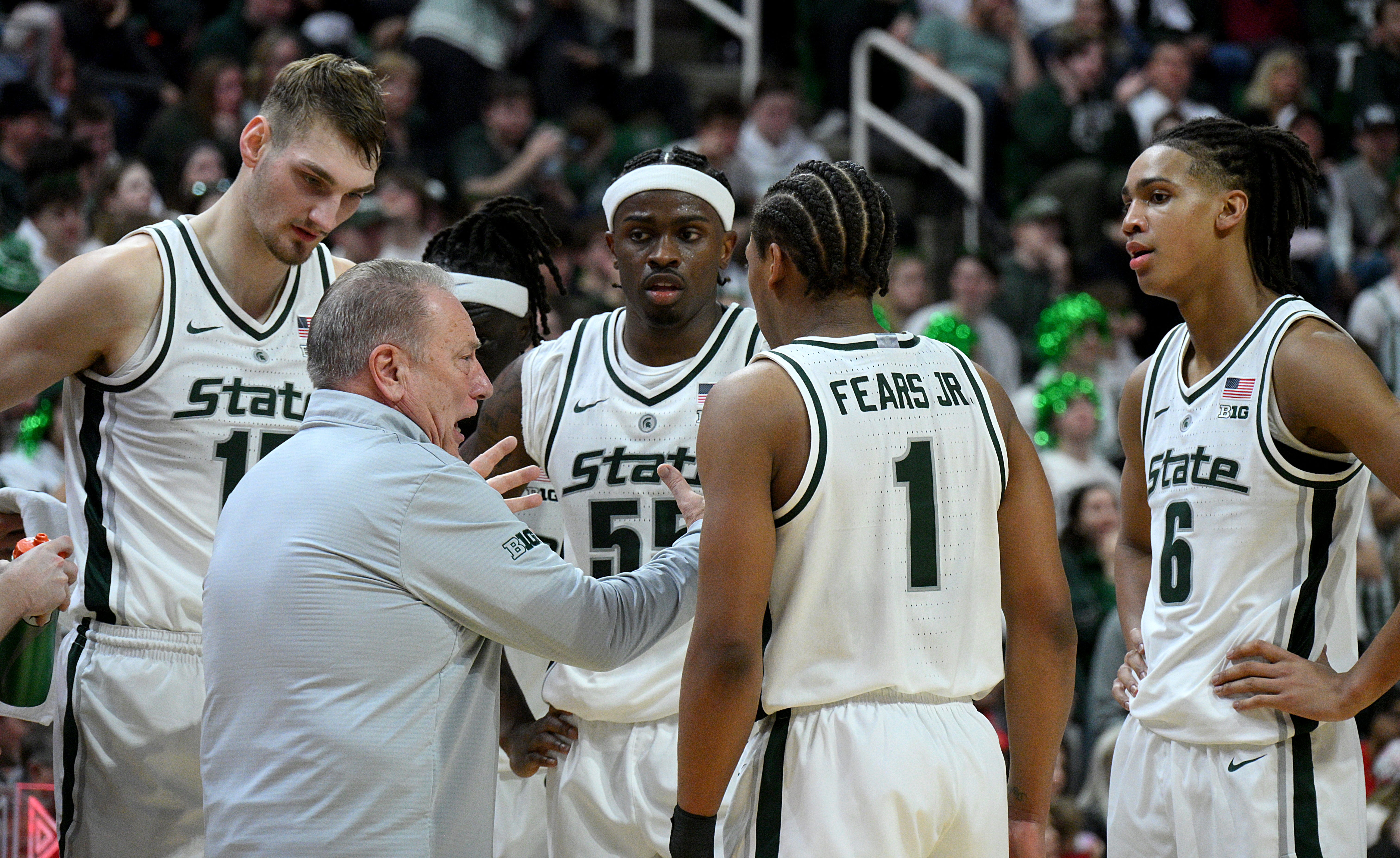 Michigan State coach Tom Izzo huddles with his players during the first half against Ohio State at the Breslin Center, Feb. 22, 2026.