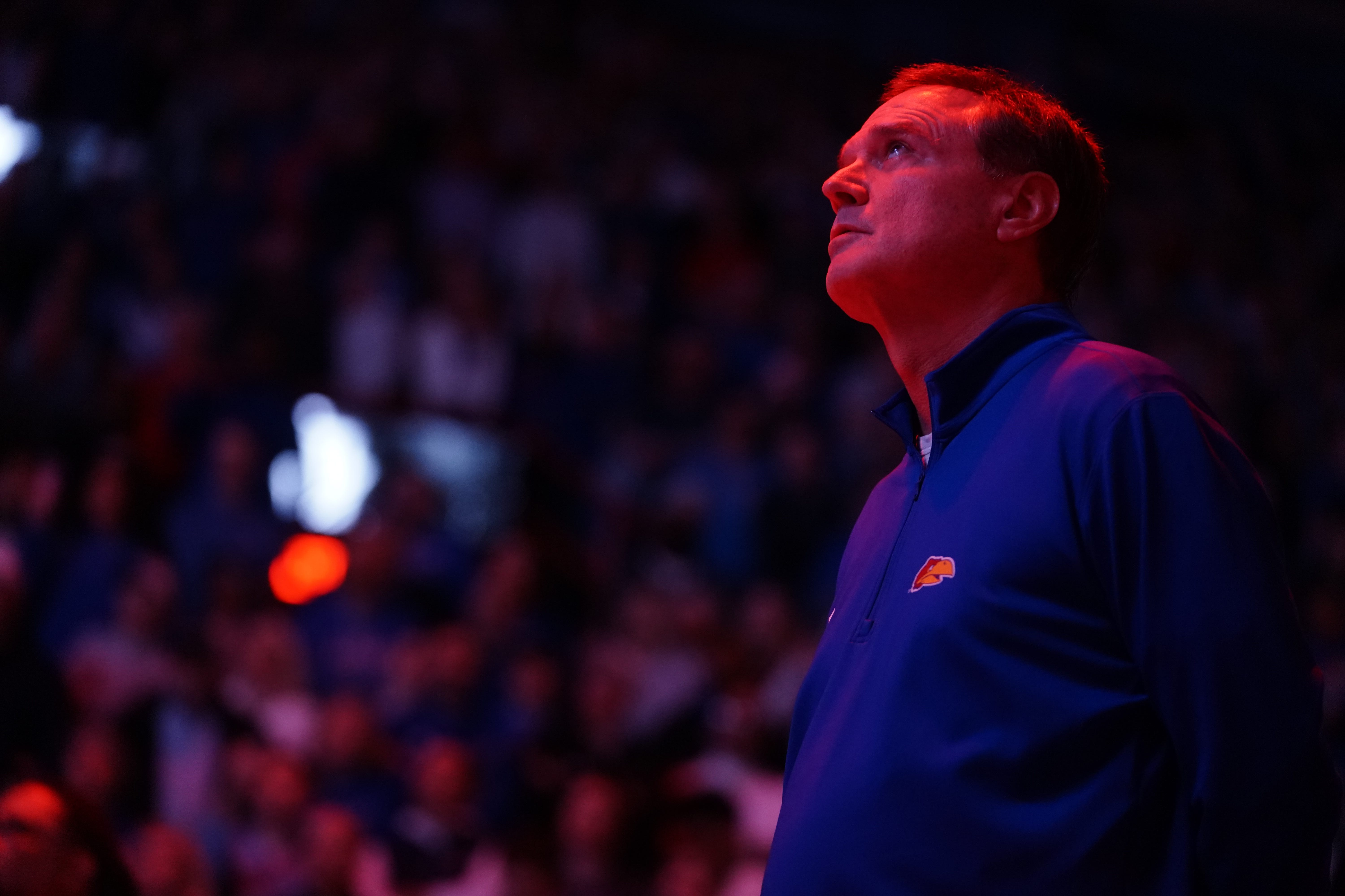 Kansas basketball coach Bill Self watches the video board before starting lineups for a game inside Allen Fieldhouse on Feb. 23, 2026.