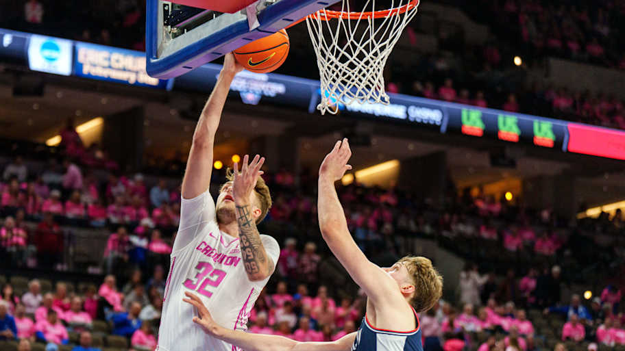 Creighton Bluejays forward Owen Freeman (32) shoots the ball against Connecticut Huskies guard Braylon Mullins (24). 