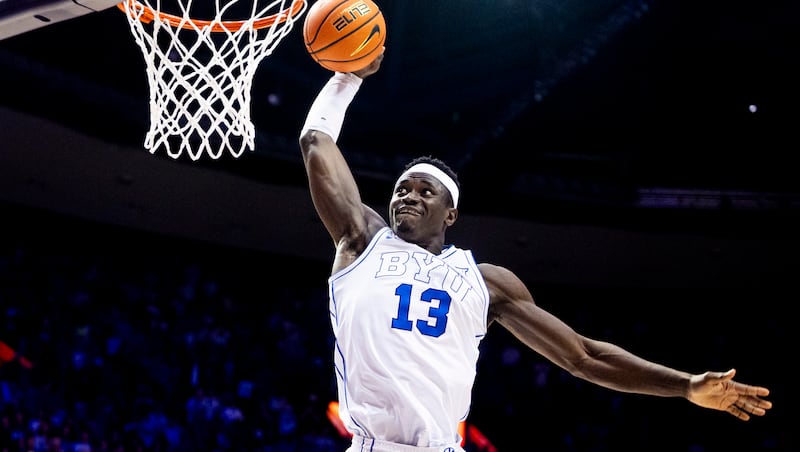 BYU center Keba Keita (13) dunks the ball on a fast break against Iowa State during an NCAA basketball game held at the Marriott Center in Provo on Saturday, Feb. 21, 2026.