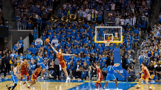 Donovan Dent #2 of the UCLA Bruins hits a shot at the halftime buzzer during an NCAA basketball game against the USC Trojans, Tuesday February 24, 2026 in Los Angeles, Calif.