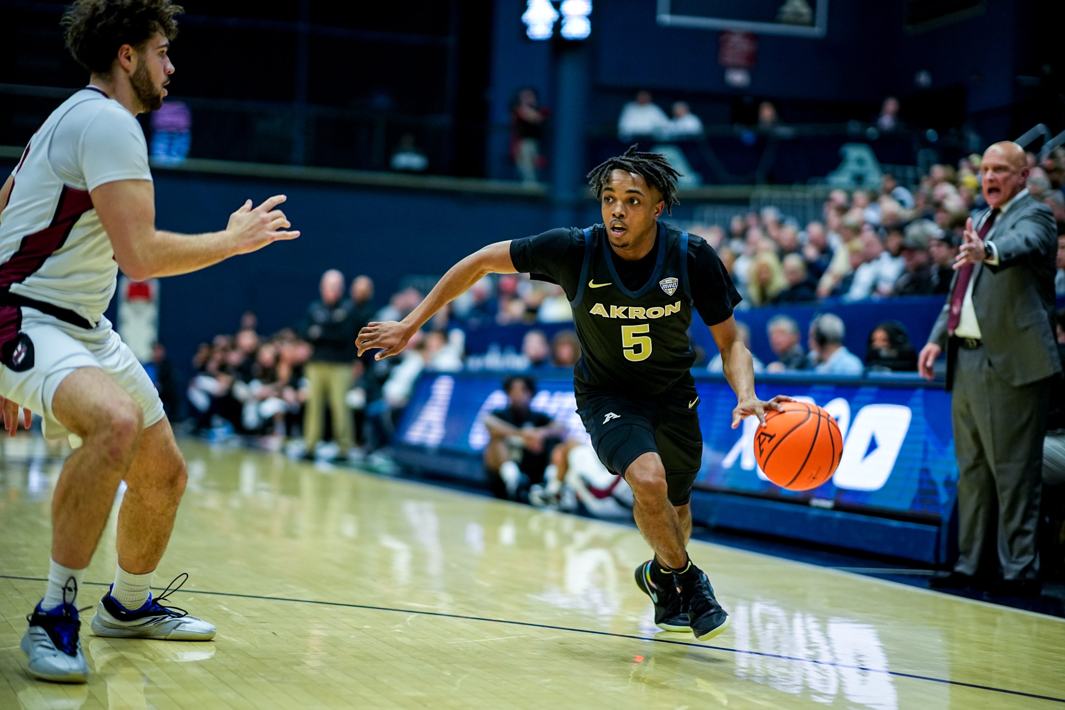 Akron Zips’ Tavari Johnson (5) dribbles in a game against UMass, Feb. 13, 2026, at James A Rhodes Arena in Akron, Ohio.