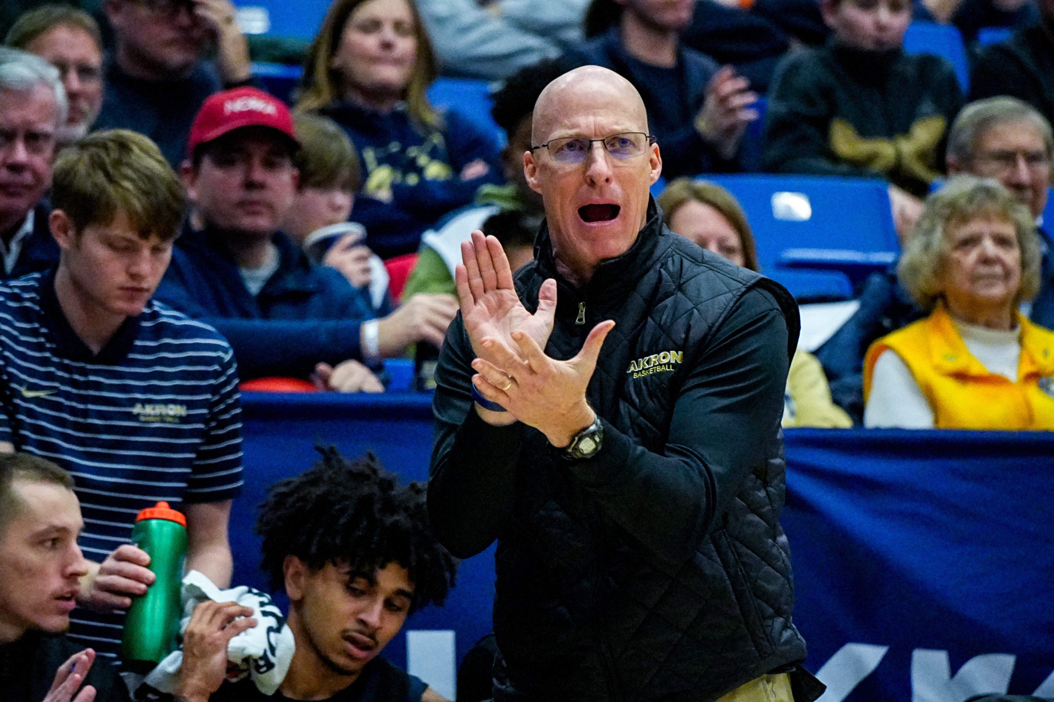 Akron Zips’ coach John Groce applauds during a game against UMass, Feb. 13, 2026, at James A Rhodes Arena in Akron, Ohio.