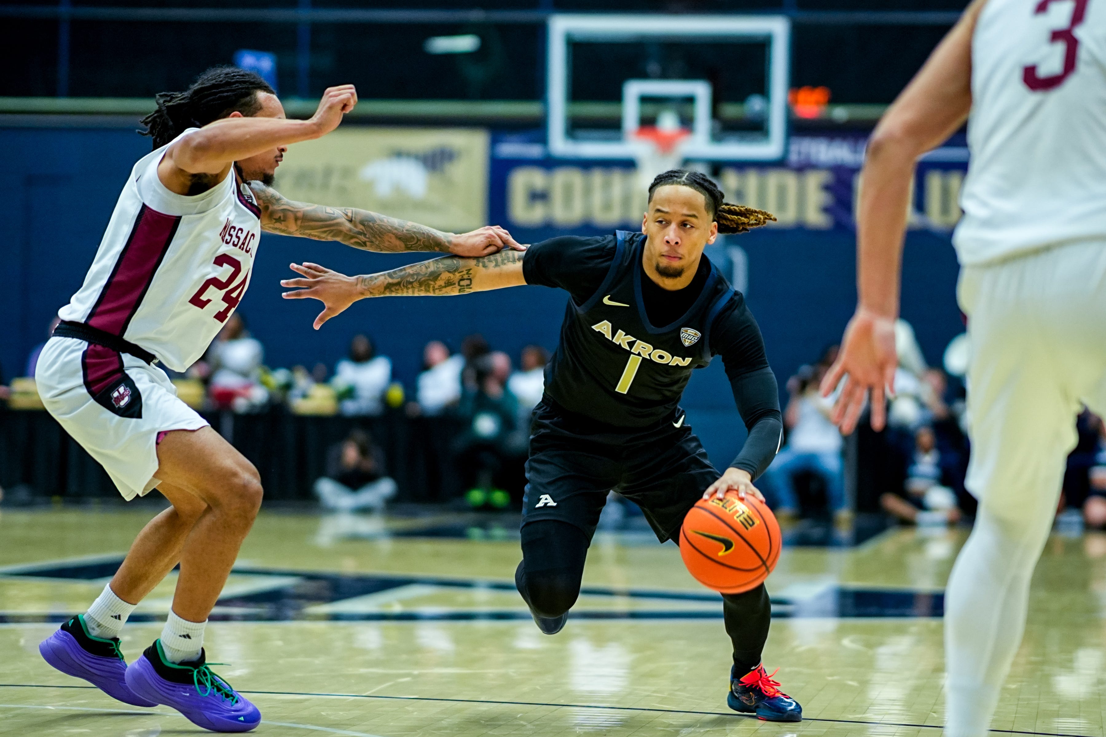 Akron Zips’ Shammah Scott (1) dribbles in a game against UMass, Feb. 13, 2026, at James A Rhodes Arena in Akron, Ohio.
