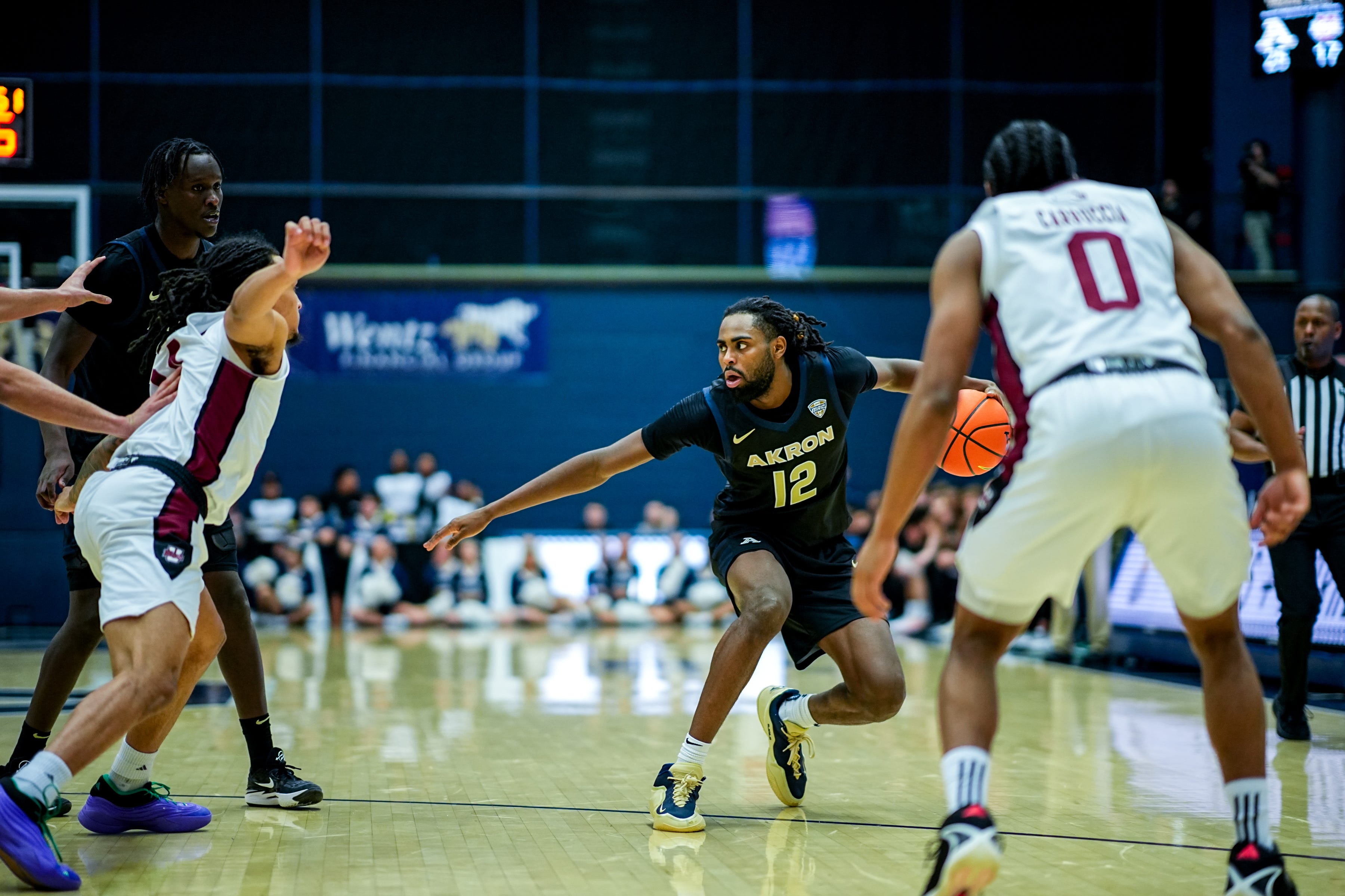 Akron Zips’ Evan Mahaffey (12) works the floor in a game against UMass, Feb. 13, 2026, at James A Rhodes Arena in Akron, Ohio.