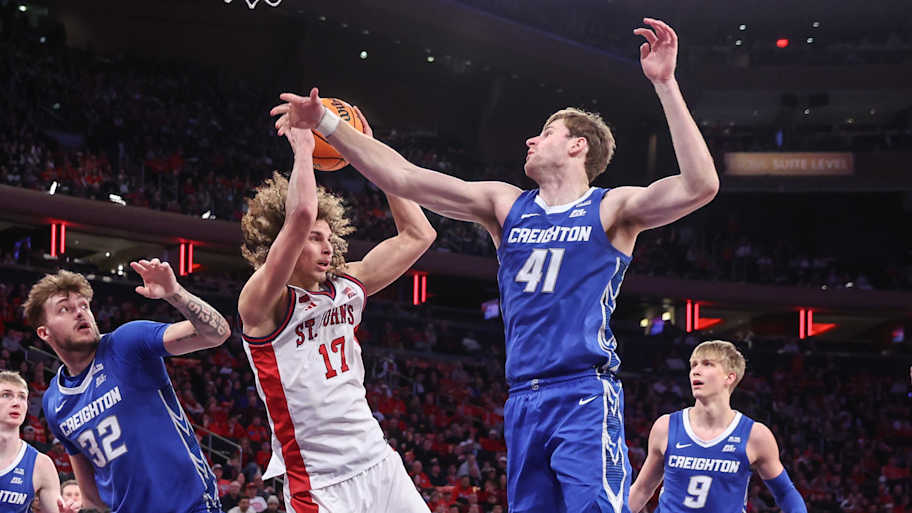 St. John's Red Storm forward Rubn Prey (17) and Creighton Bluejays forward Isaac Traudt (41) fight for a loose ball.
