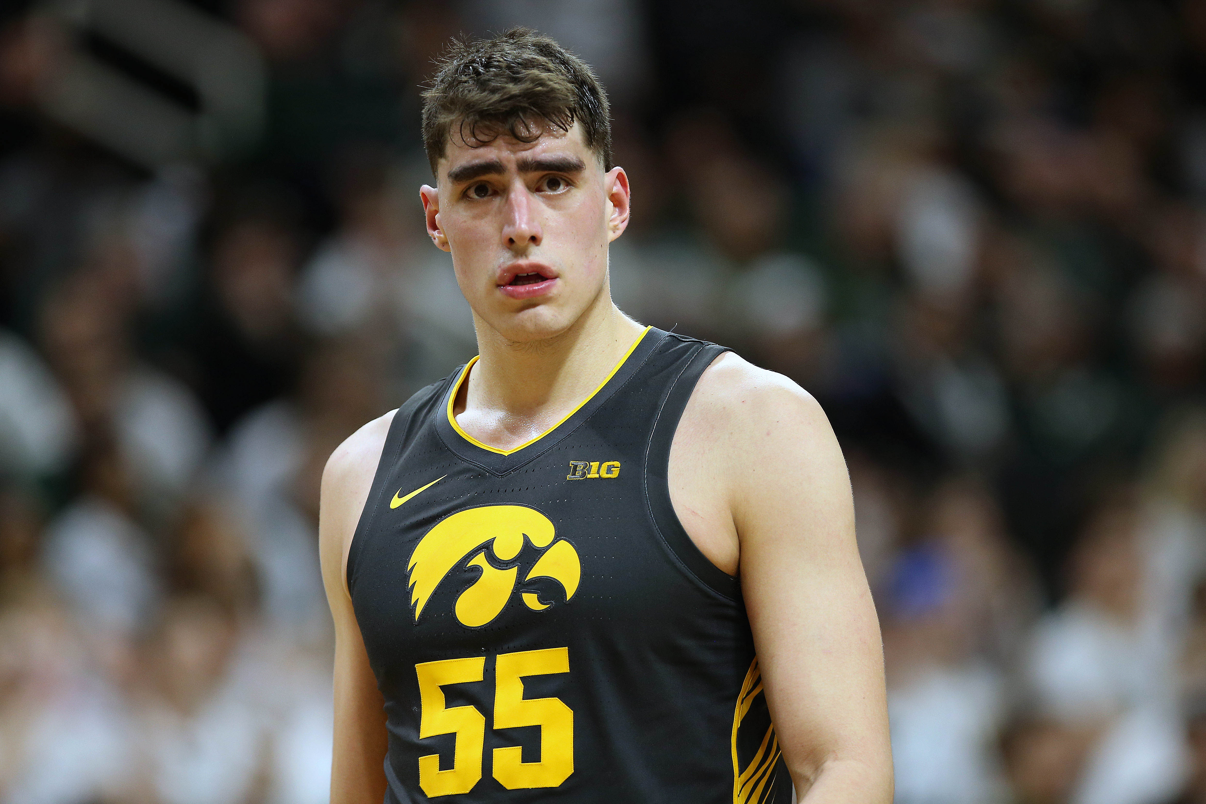 Feb 25, 2020; East Lansing, Michigan, USA; Iowa Hawkeyes center Luka Garza (55) stands on the court during the second half a game against the Michigan State Spartans at the Breslin Center. Mandatory Credit: Mike Carter-USA TODAY Sports