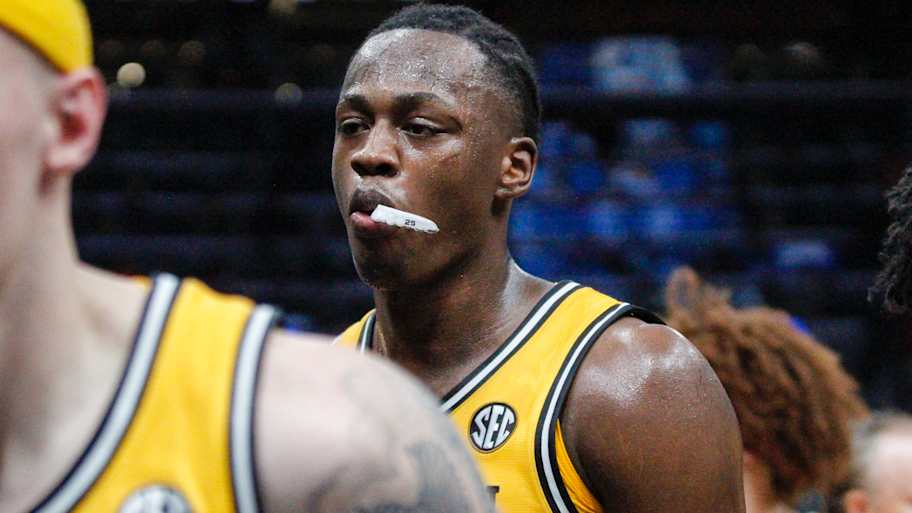 Mark Mitchell walks towards the bench during a time out vs Illinois