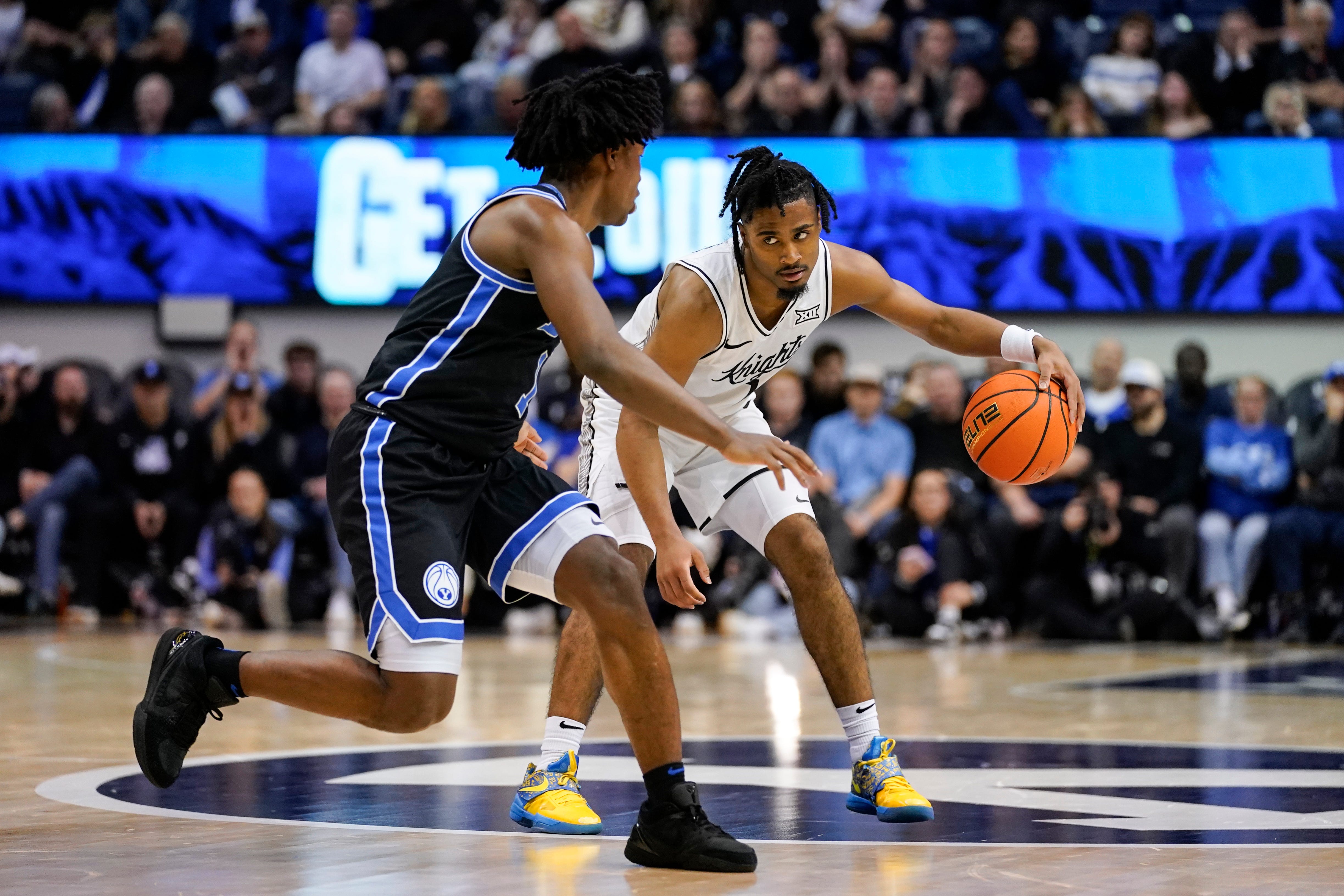 Feb 24, 2026; Provo, Utah, USA; UCF Knights guard Themus Fulks (1) controls the ball during the second half against the BYU Cougars at Marriott Center. Mandatory Credit: Aaron Baker-Imagn Images
