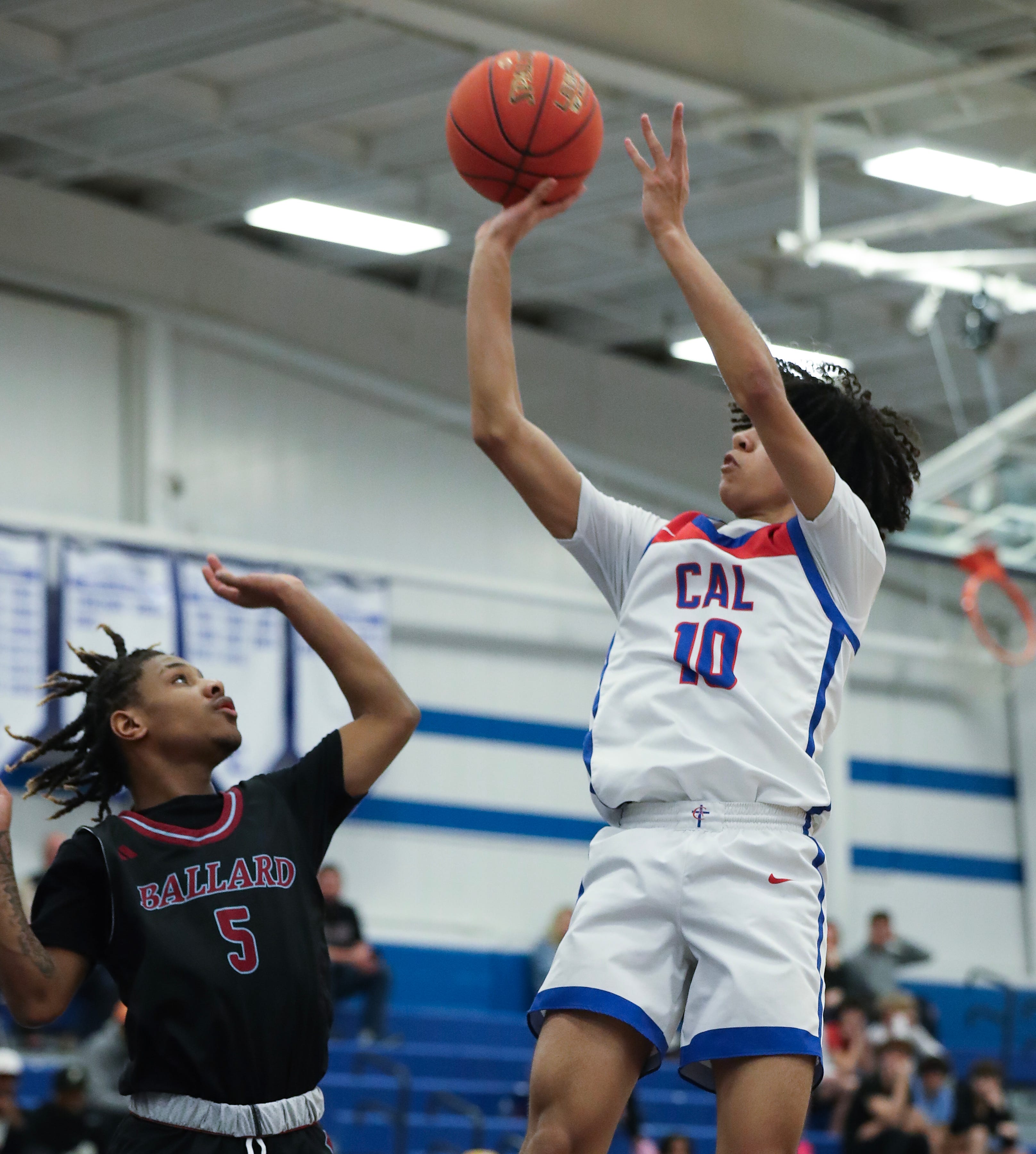 CAL's Jayden Washington (10) shot against Ballard's Nate Richardson (5) during the 28th District semifinal at the Eastern High School in Louisville, Ky. on Feb. 26, 2024.