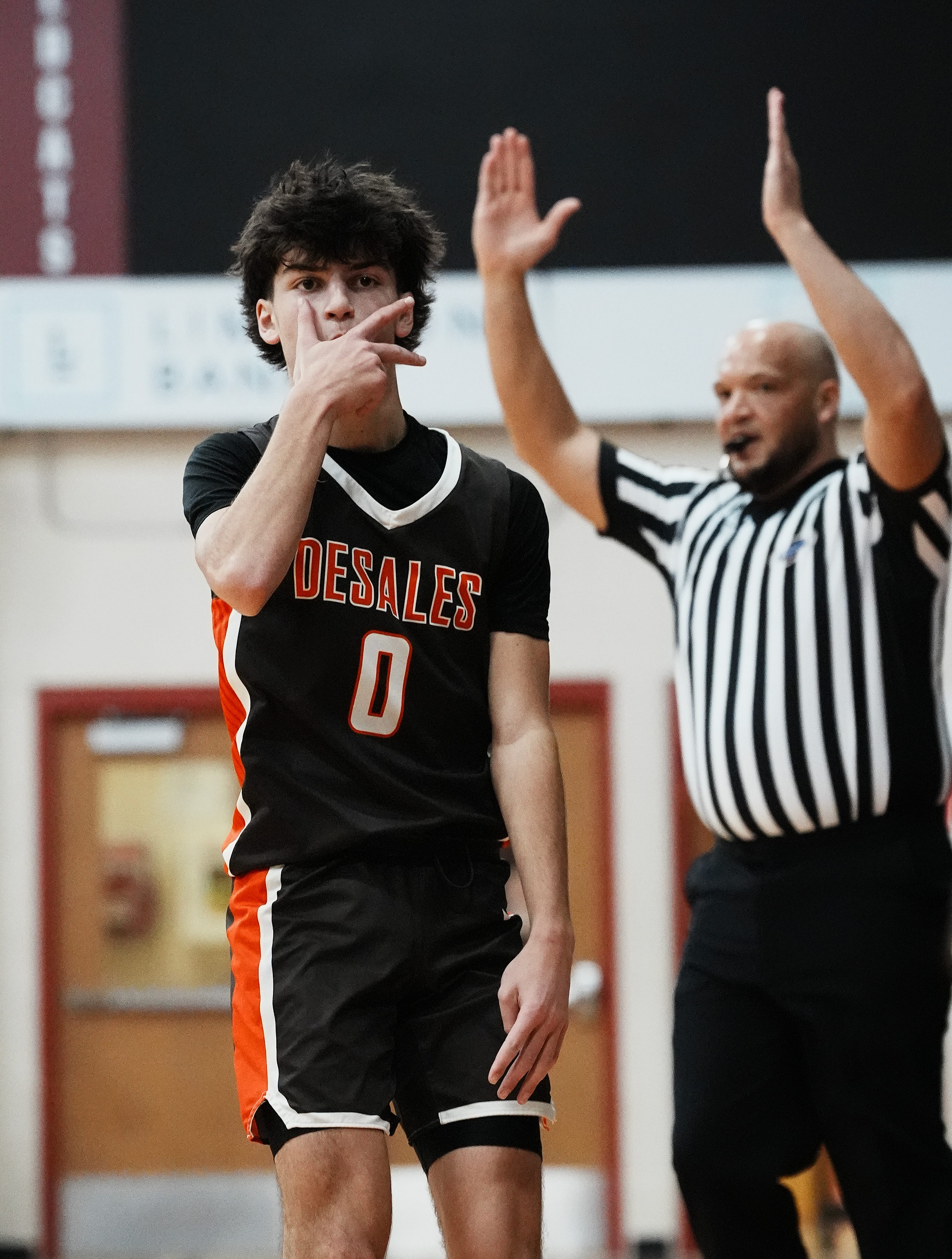 Desales' Cameron Bischoff (0) motioned to Butler's Jaion Hansberry (11) after he hit a three-point shot against him during the championship of Henry County Invitational Tournament at the Henry County High School in New Castle, Ky. on Dec. 29, 2024.