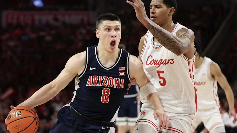 Ivan Kharchenkov dribbles against Houston Cougars center Chris Cenac Jr. in the first half at Fertitta Center. 