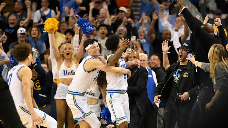 Donovan Dent celebrates scoring the winning basket in overtime against the Illinois Fighting Illini at Pauley Pavilion.