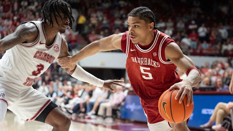 Acuff Jr. drives against Alabama guard Latrell Wrightsell Jr. at Coleman Coliseum.