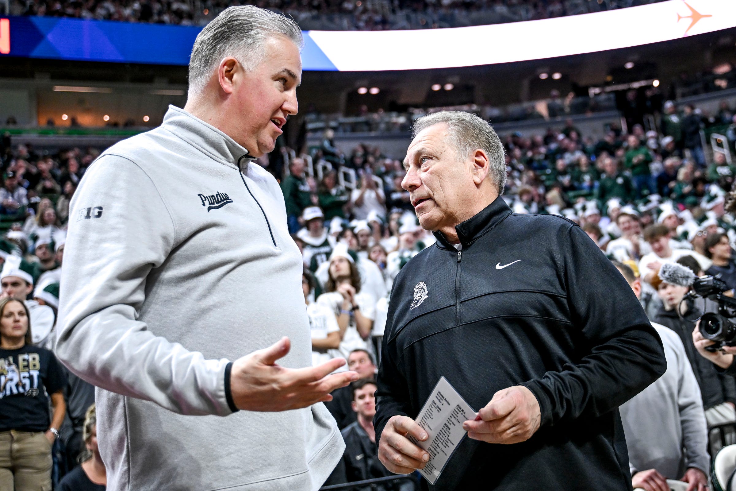 Michigan State's head coach Tom Izzo, right, talks with Purdue's head coach Matt Painter before the game on Tuesday, Feb. 18, 2025, at the Breslin Center in East Lansing.