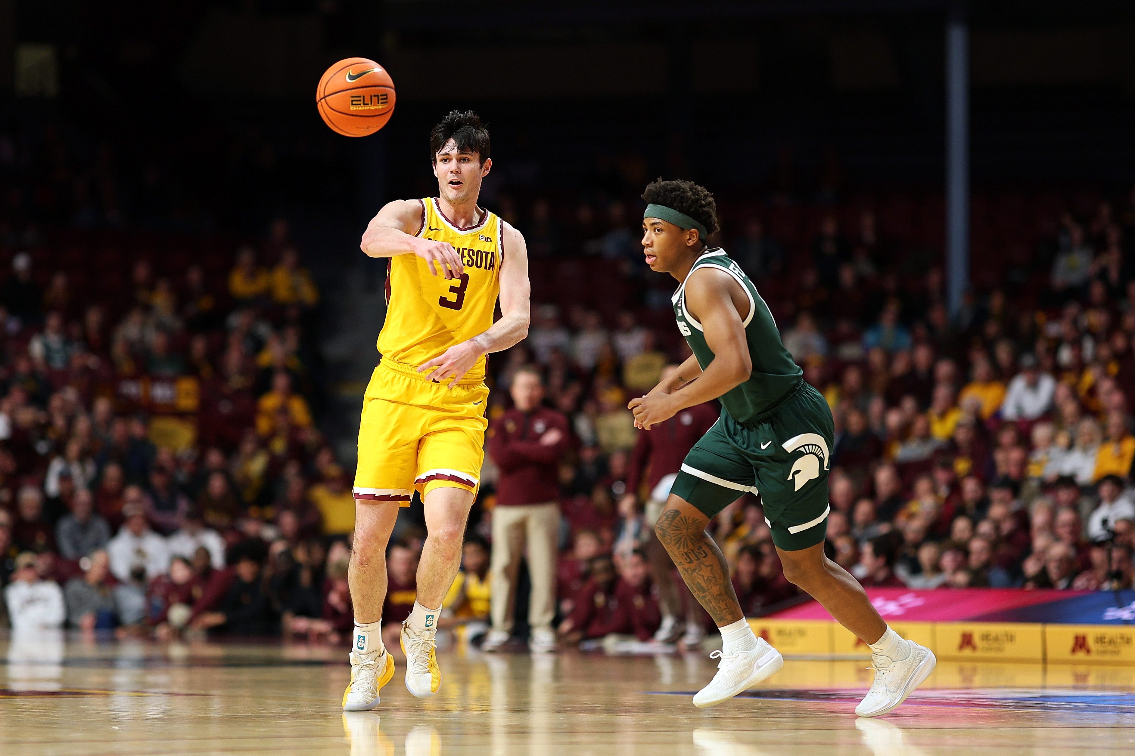 Bobby Durkin of the Minnesota Golden Gophers passes the ball against Jeremy Fears Jr. of the Michigan State Spartans in the first half at Williams Arena on Feb. 4, 2026, in Minneapolis.