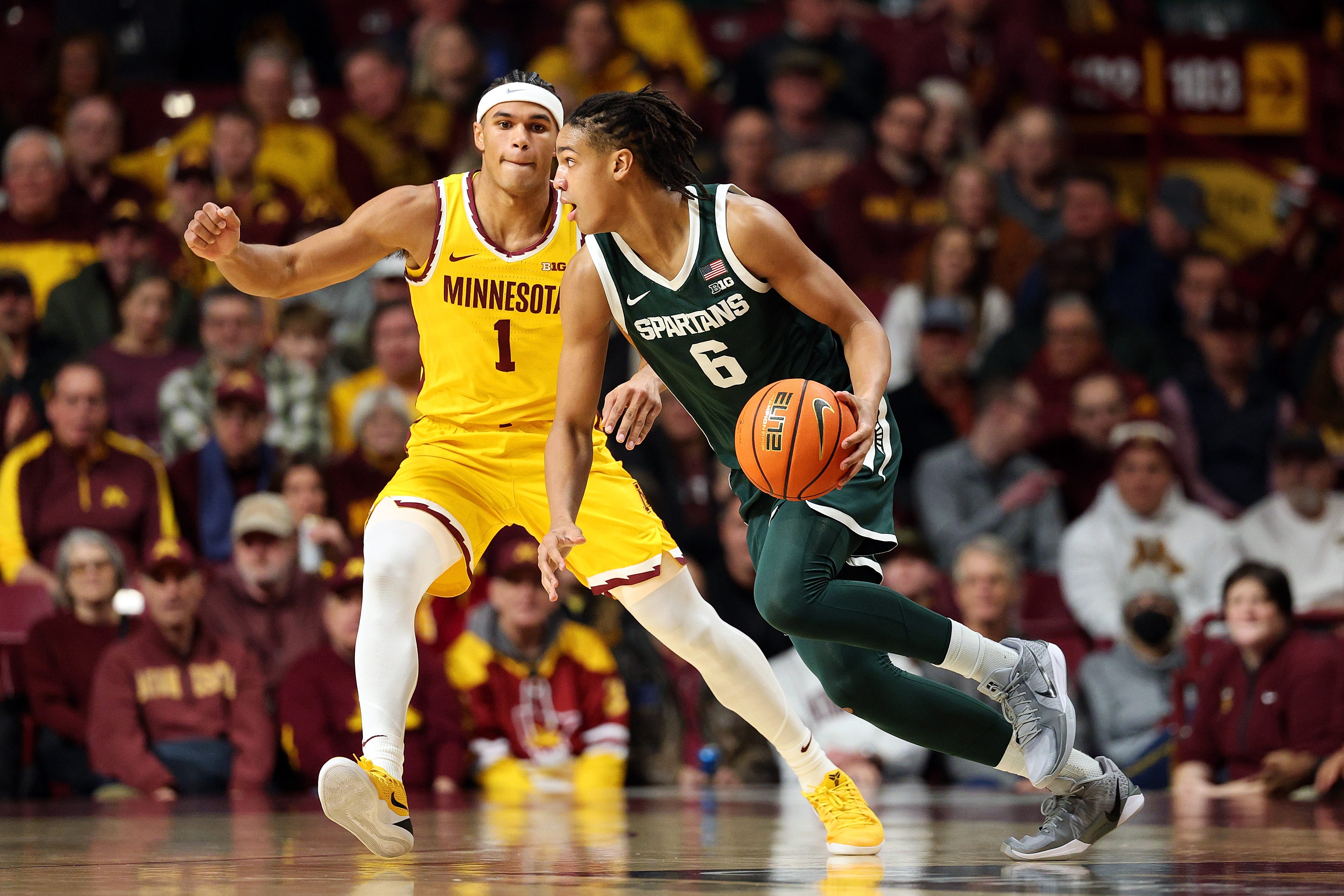 Jordan Scott of the Michigan State Spartans drives to the basket against Isaac Asuma of the Minnesota Golden Gophers in the first half at Williams Arena on Feb. 4, 2026, in Minneapolis.