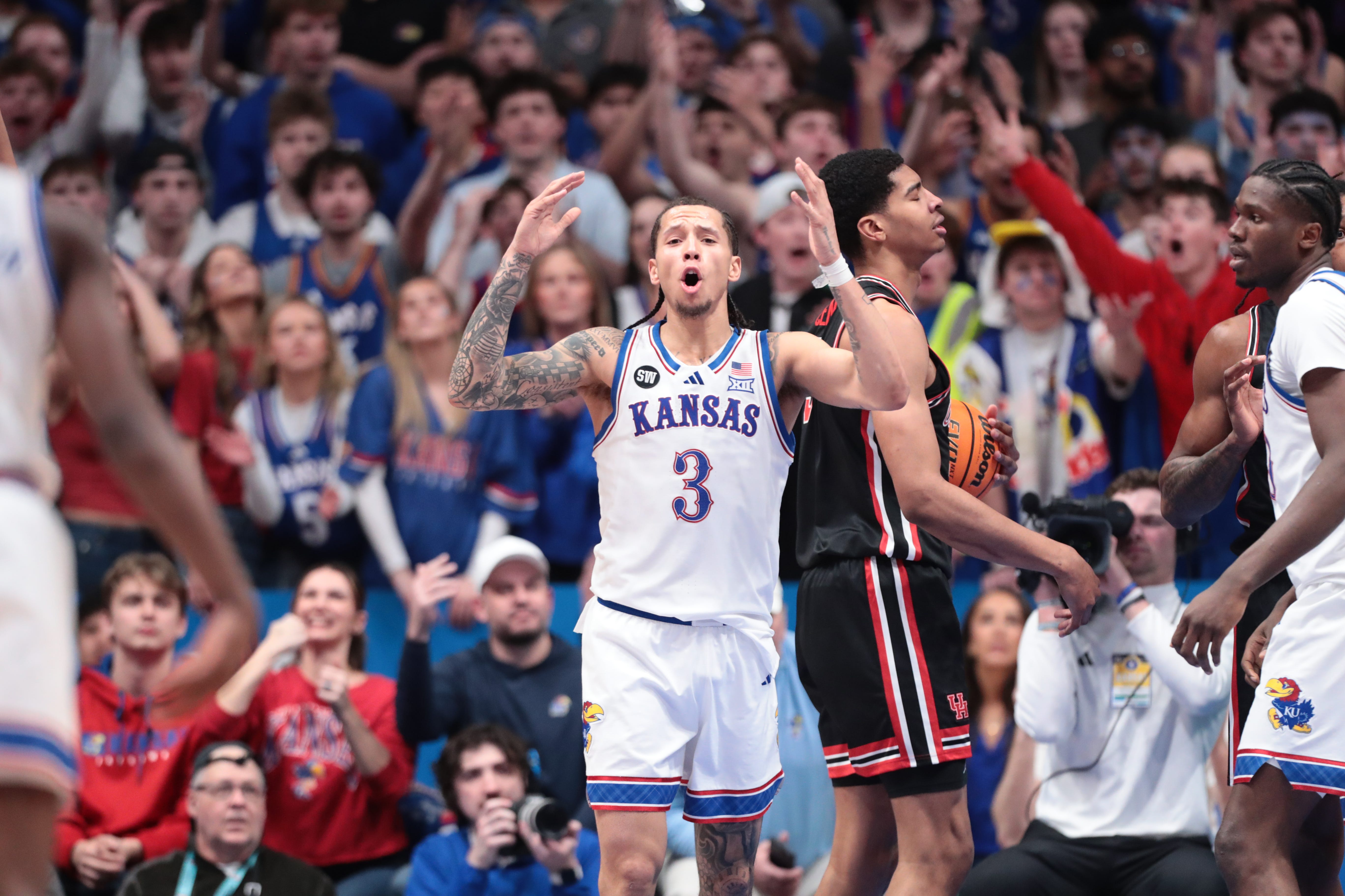 Kansas basketball guard Tre White (3) reacts to a play against Houston during a game inside Allen Fieldhouse on Feb. 23, 2026.