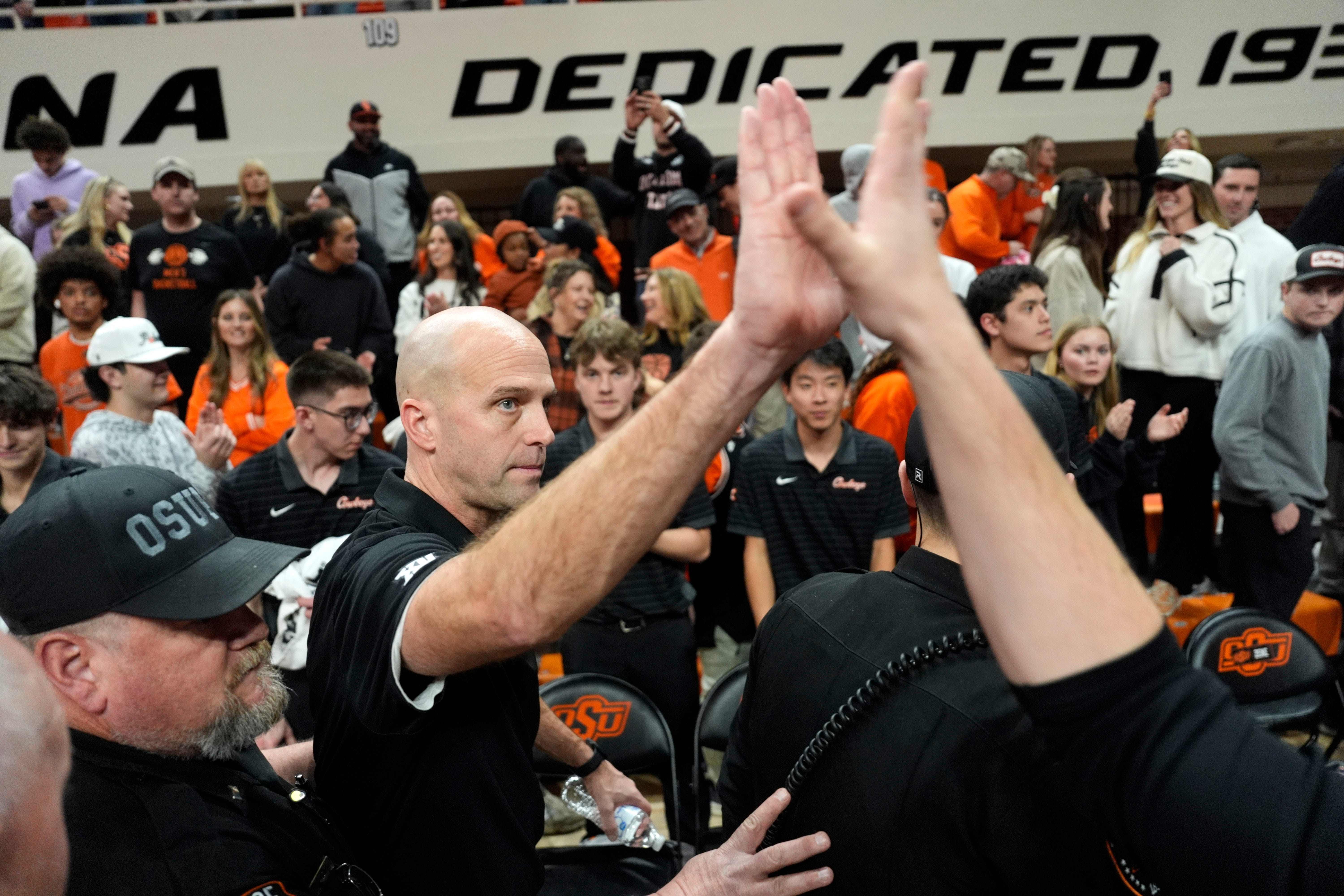 Oklahoma State coach Steve Lutz celebrates with fans during a BIG 12 men's college basketball game between the Oklahoma State Cowboys (OSU) and the BYU Cougars at Gallagher-Iba Arena in Stillwater, Okla., Wednesday, Feb. 4, 2026.