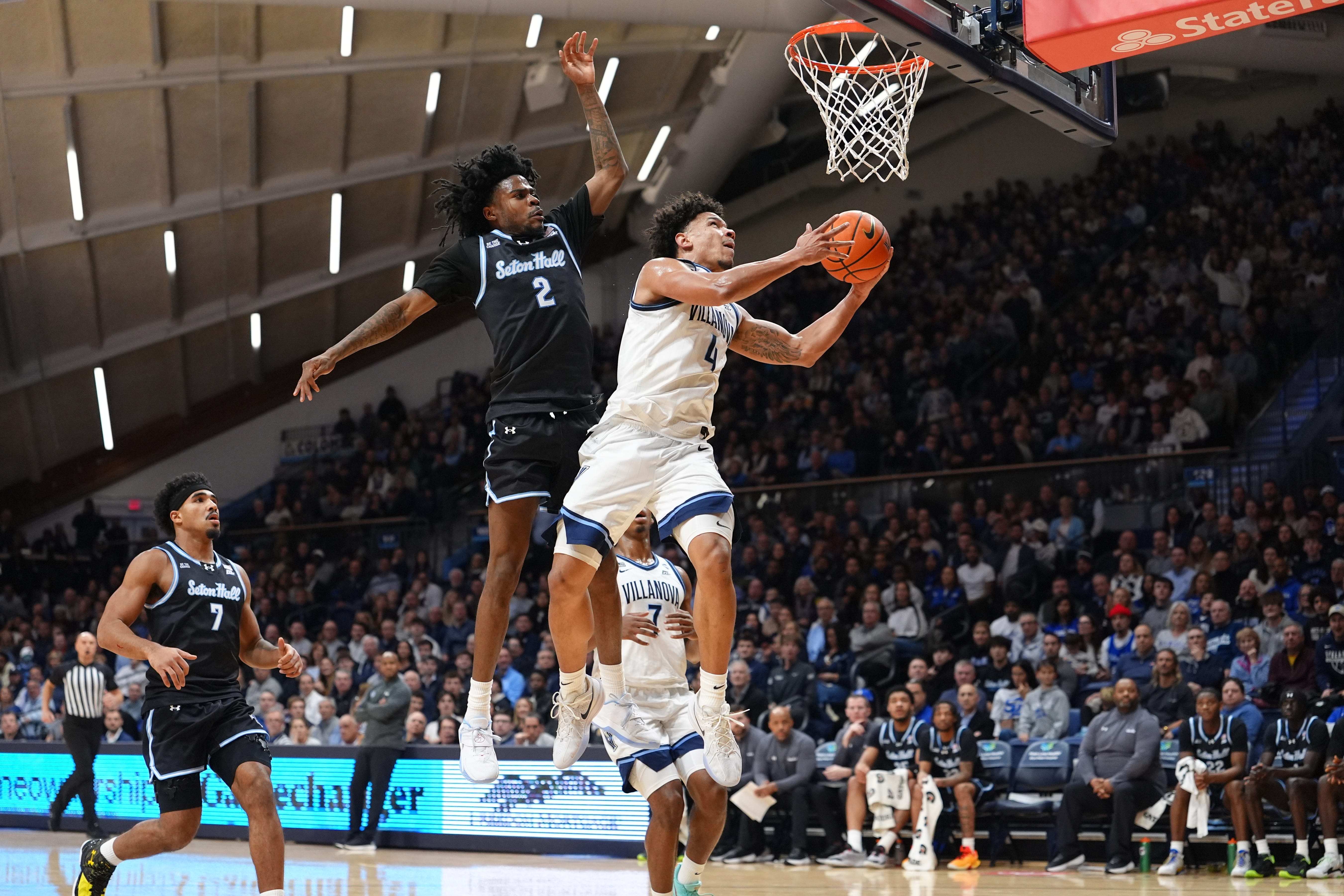 Feb 4, 2026; Villanova, Pennsylvania, USA; Villanova Wildcats guard Tyler Perkins (4) drives to shoot against Seton Hall Pirates guard Tajuan Simpkins (2) in the first half at William B. Finneran Pavilion. Mandatory Credit: Kyle Ross-Imagn Images