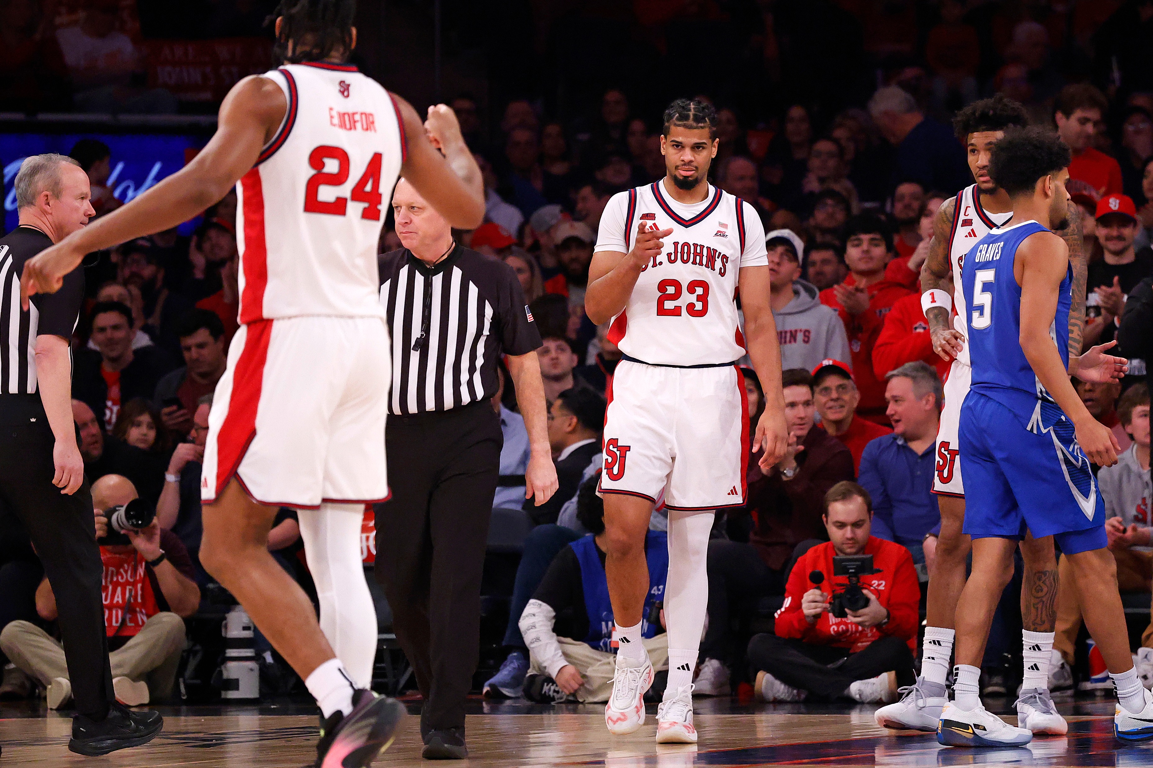Bryce Hopkins and Zuby Ejiofor of the St. John's Red Storm basketball team celebrate during a game against the Creighton Bluejays.