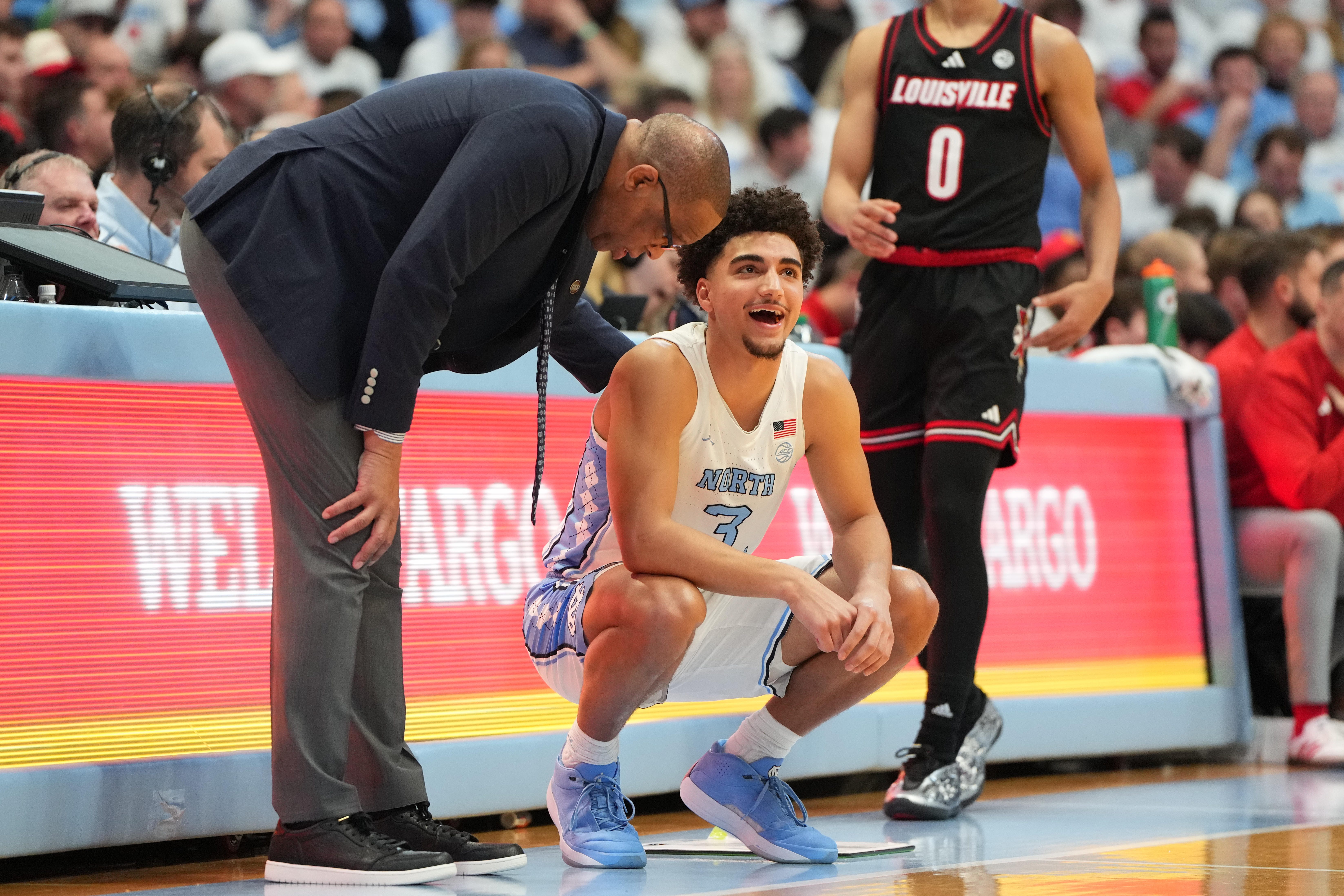 Feb 23, 2026; Chapel Hill, North Carolina, USA; North Carolina Tar Heels head coach Hubert Davis with guard Derek Dixon (3) in the second half at Dean E. Smith Center. Mandatory Credit: Bob Donnan-Imagn Images