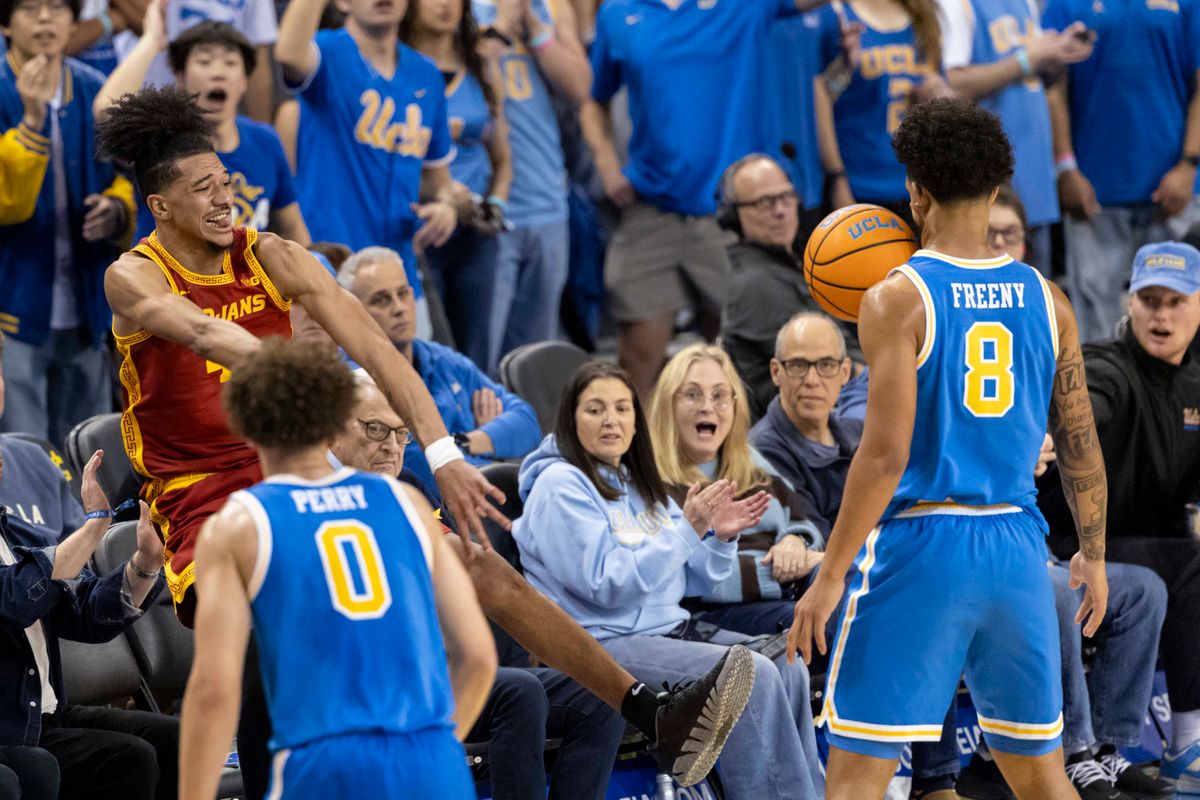 Chad Baker-Mazara #4 of the USC Trojans saves the ball by throwing off the face of Eric Freeny #8 of the UCLA Bruins during an NCAA basketball game, Tuesday February 24, 2026 in Los Angeles, Calif. Chad Baker-Mazara #4 of the USC Trojans saves the ball by throwing off the face of Eric Freeny #8 of the UCLA Bruins during an NCAA basketball game, Tuesday February 24, 2026 in Los Angeles, Calif.