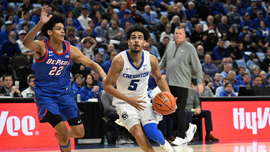 Creighton Bluejays guard Nik Graves (5) drives against DePaul Blue Demons guard Kruz McClure (22).