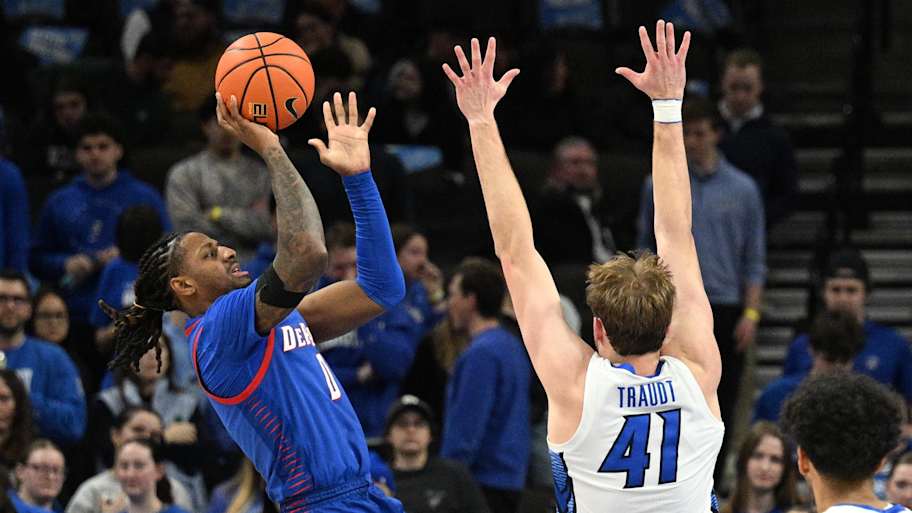 DePaul Blue Demons guard Brandon MacLin (0) scores over Creighton Bluejays forward Isaac Traudt (41).