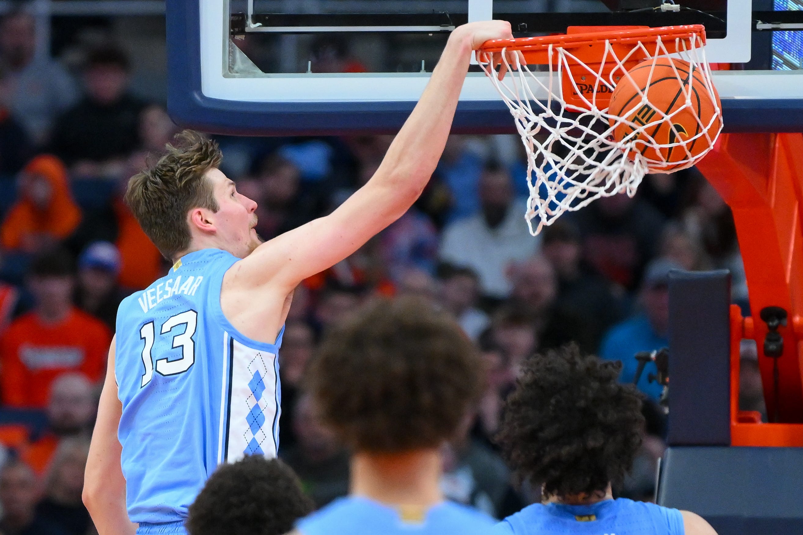 Feb 21, 2026; Syracuse, New York, USA; North Carolina Tar Heels center Henri Veesaar (13) dunks during the second half against the Syracuse Orange at the JMA Wireless Dome. Mandatory Credit: Rich Barnes-Imagn Images