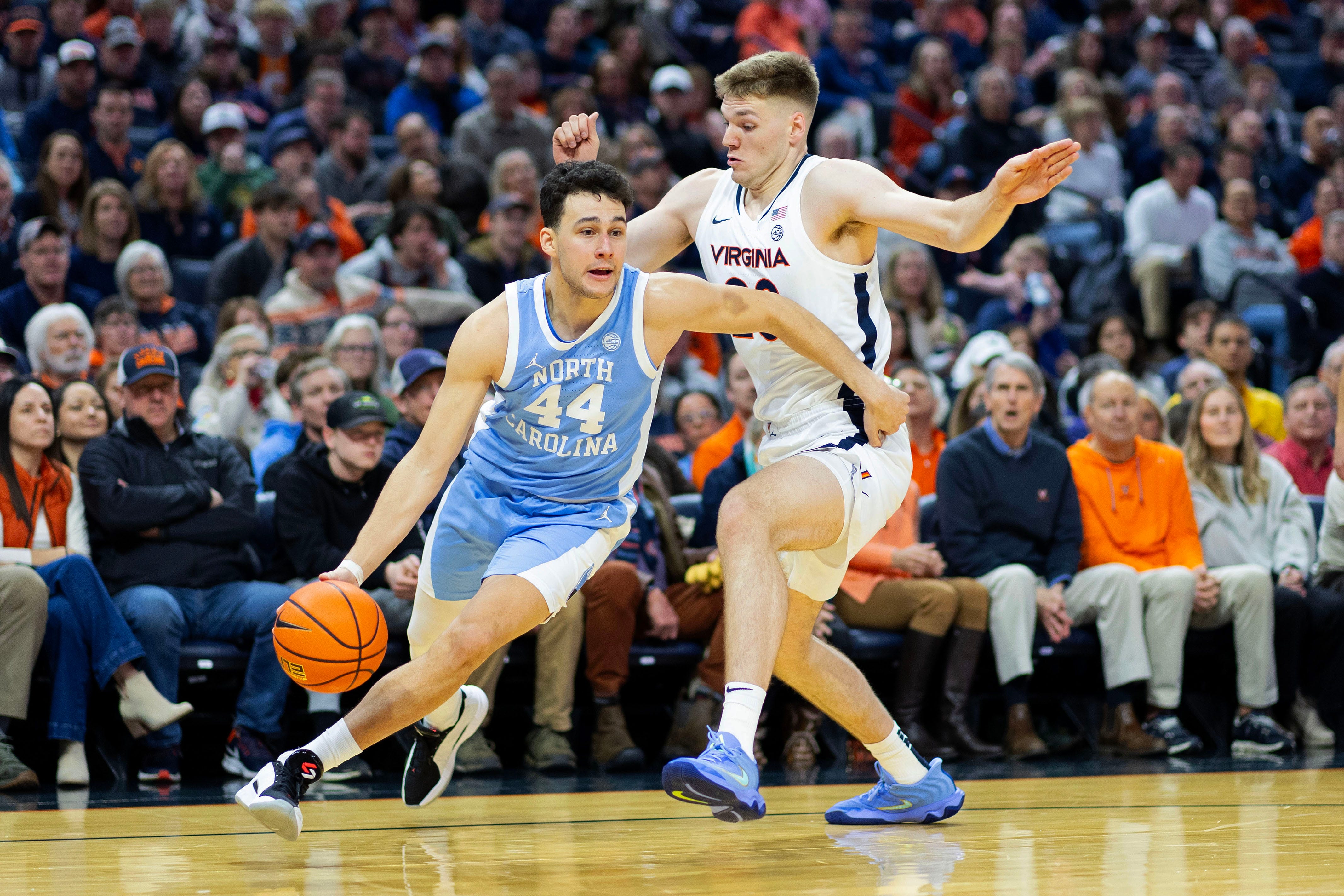 CHARLOTTESVILLE, VIRGINIA - JANUARY 24: Luka Bogavac #44 of the North Carolina Tar Heels drives past Thijs de Ridder #28 of the Virginia Cavaliers in the first half of a game at John Paul Jones Arena on January 24, 2026 in Charlottesville, Virginia. (Photo by Ryan M. Kelly/Getty Images)