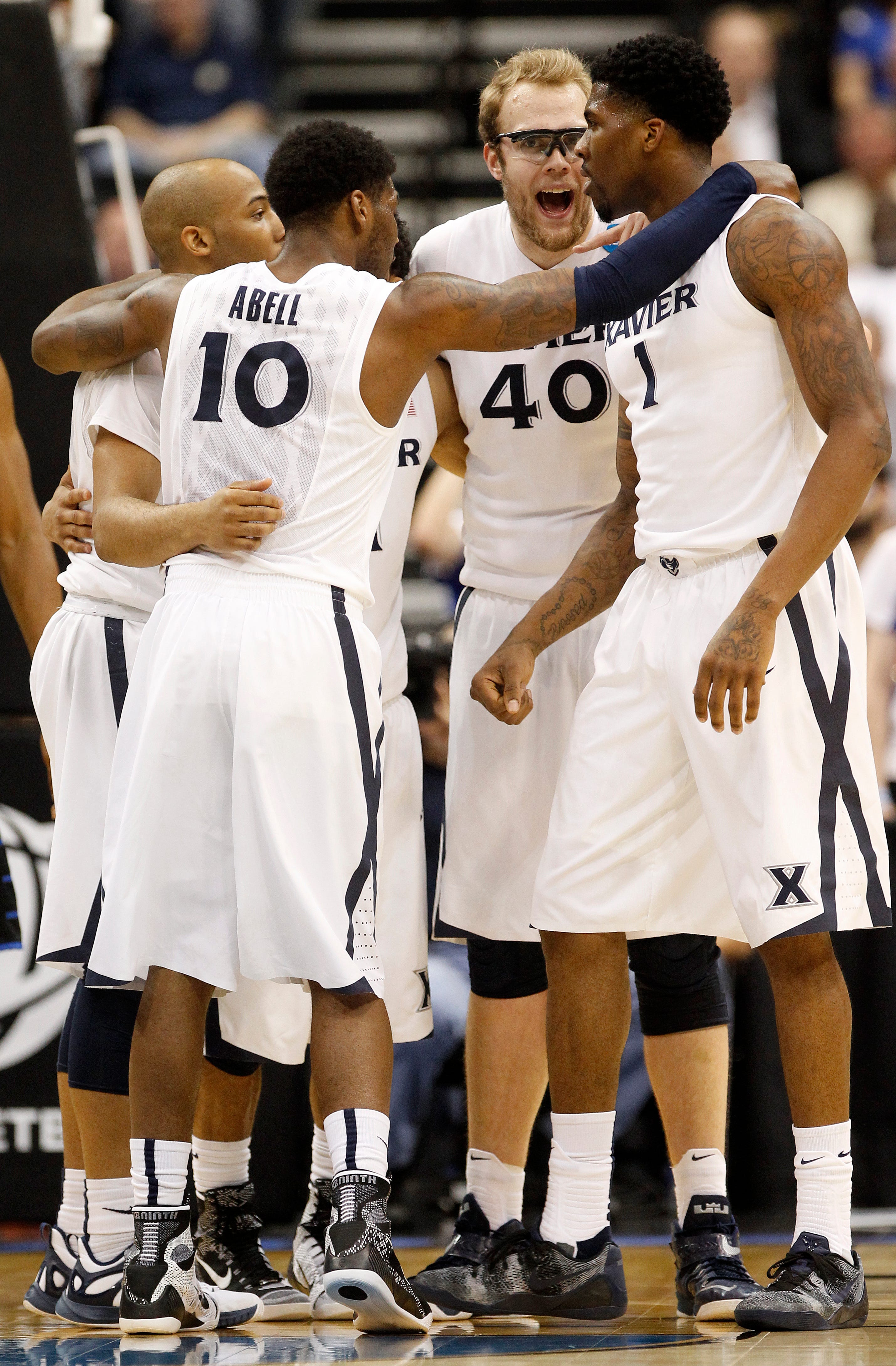 Myles Davis, Remy Abell, Matt Stainbrook and Jalen Reynolds huddle during a second-round NCAA Tournament win over Georgia State that sent Xavier to the Sweet 16 in 2015.
