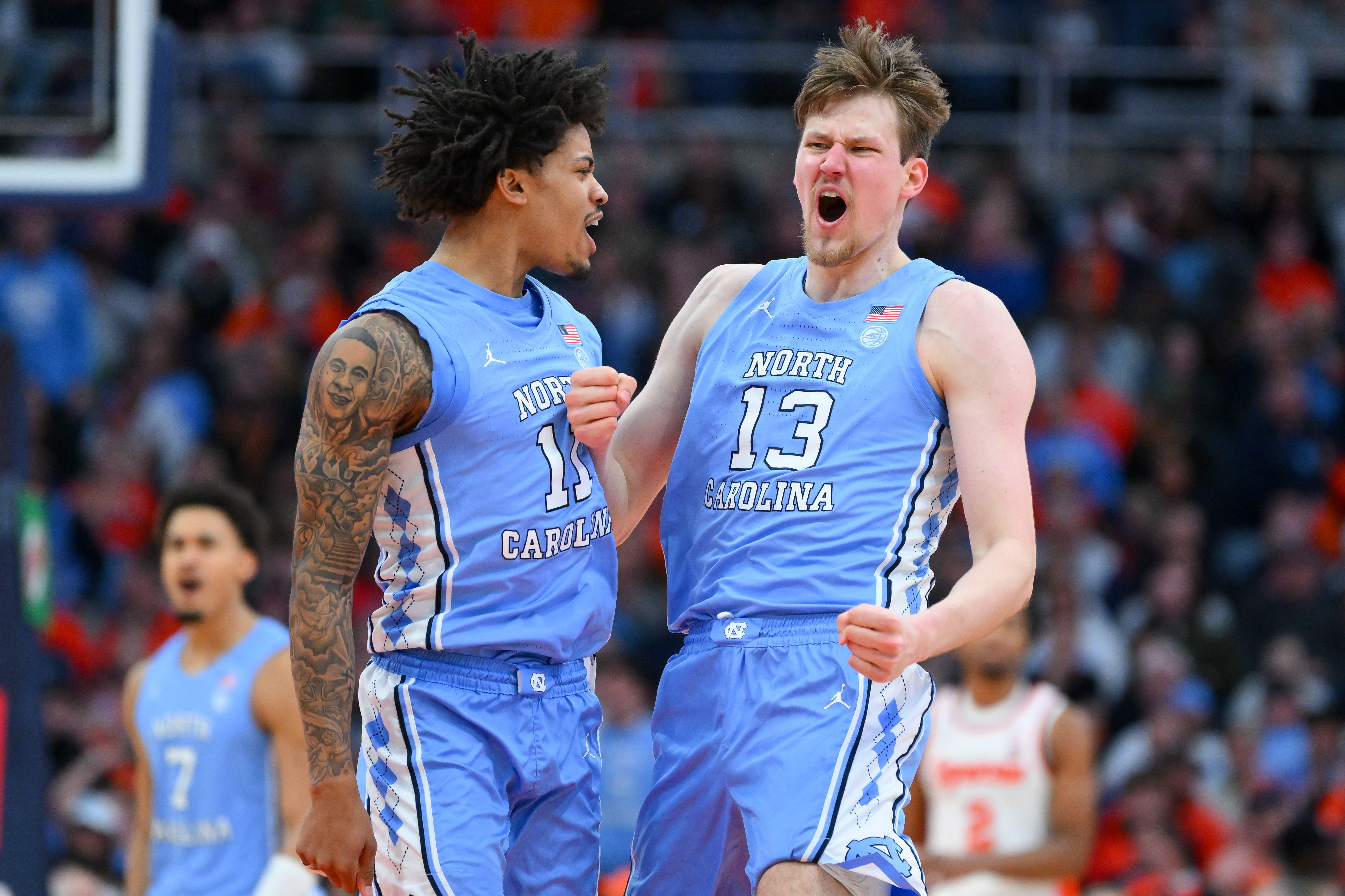 Feb 21, 2026; Syracuse, New York, USA; North Carolina Tar Heels forward Jonathan Powell (11) and center Henri Veesaar (13) react during the second half against the Syracuse Orange at the JMA Wireless Dome. Mandatory Credit: Rich Barnes-Imagn Images