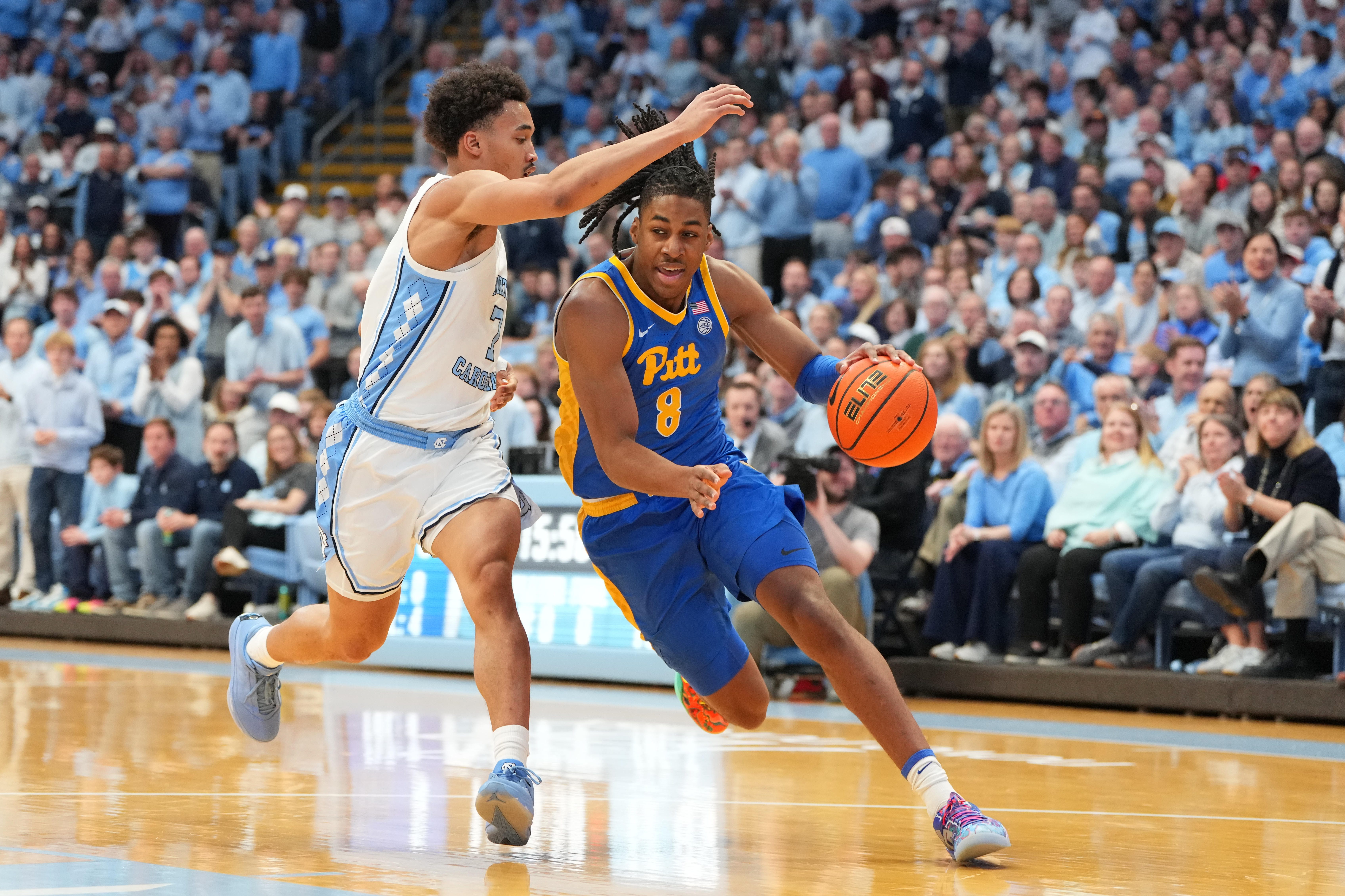 Feb 14, 2026; Chapel Hill, North Carolina, USA; Pittsburgh Panthers guard Omari Witherspoon (8) with the ball as North Carolina Tar Heels guard Seth Trimble (7) defends in the first half at Dean E. Smith Center. Mandatory Credit: Bob Donnan-Imagn Images