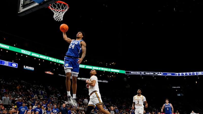 BYU forward Dominique Diomande (24) dunks during the first half of the game against the West Virginia Mountaineers in the second round of the 2026 Phillips 66 Big 12 Men's Basketball Tournament at the T-Mobile Center in Kansas City, Missouri, on Wednesday, March 11, 2026.