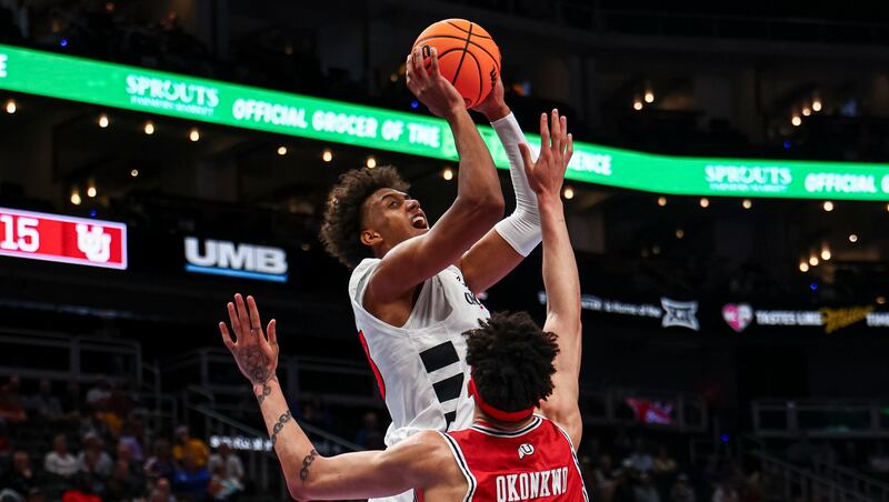 Cincinnati Bearcats forward Baba Miller (18) drives to the basket against Utah forward James Okonkwo (32) during Phillips 66 Big 12 Men's Basketball Tournament at the T-Mobile Center in Kansas City, Mo., on Tuesday, March 10, 2026.