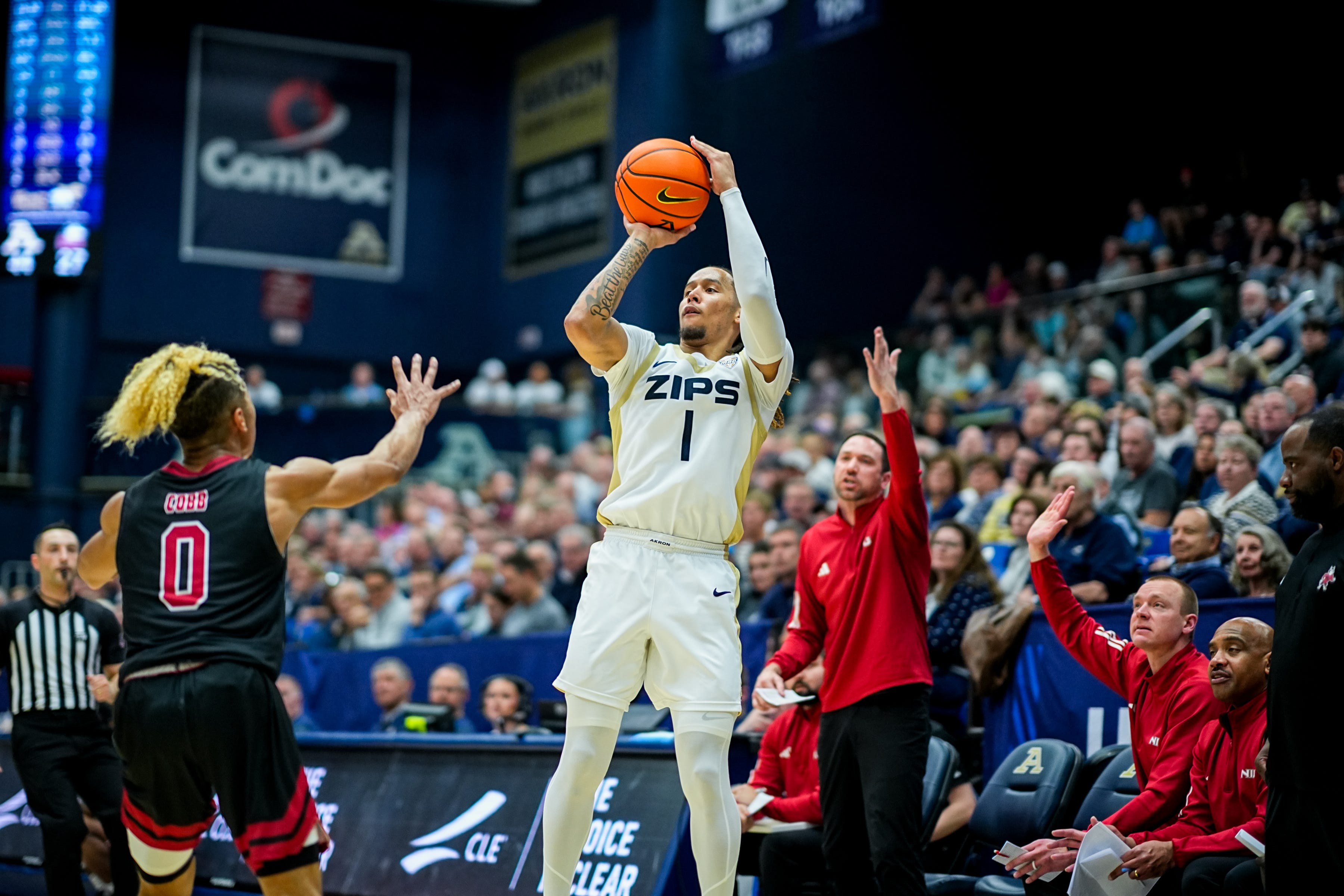Akron Zips’ Shammah Scott (1) launches a three pointer during a Mid American Conference men’s basketball game against NIU, March 6, 2026, at James A Rhodes Arena in Akron, Ohio.