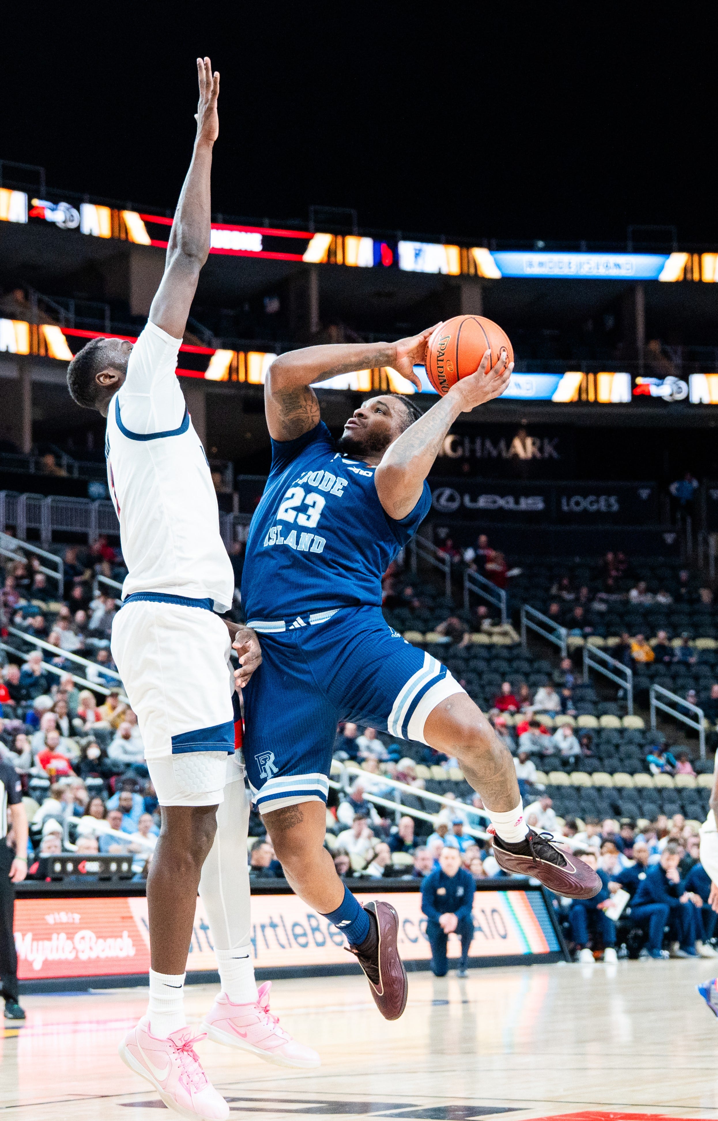 Tyler Cochran, right, led Rhode Island with 34 points on Thursday against Duquesne at the Atlantic 10 Tournament in Pittsburgh.