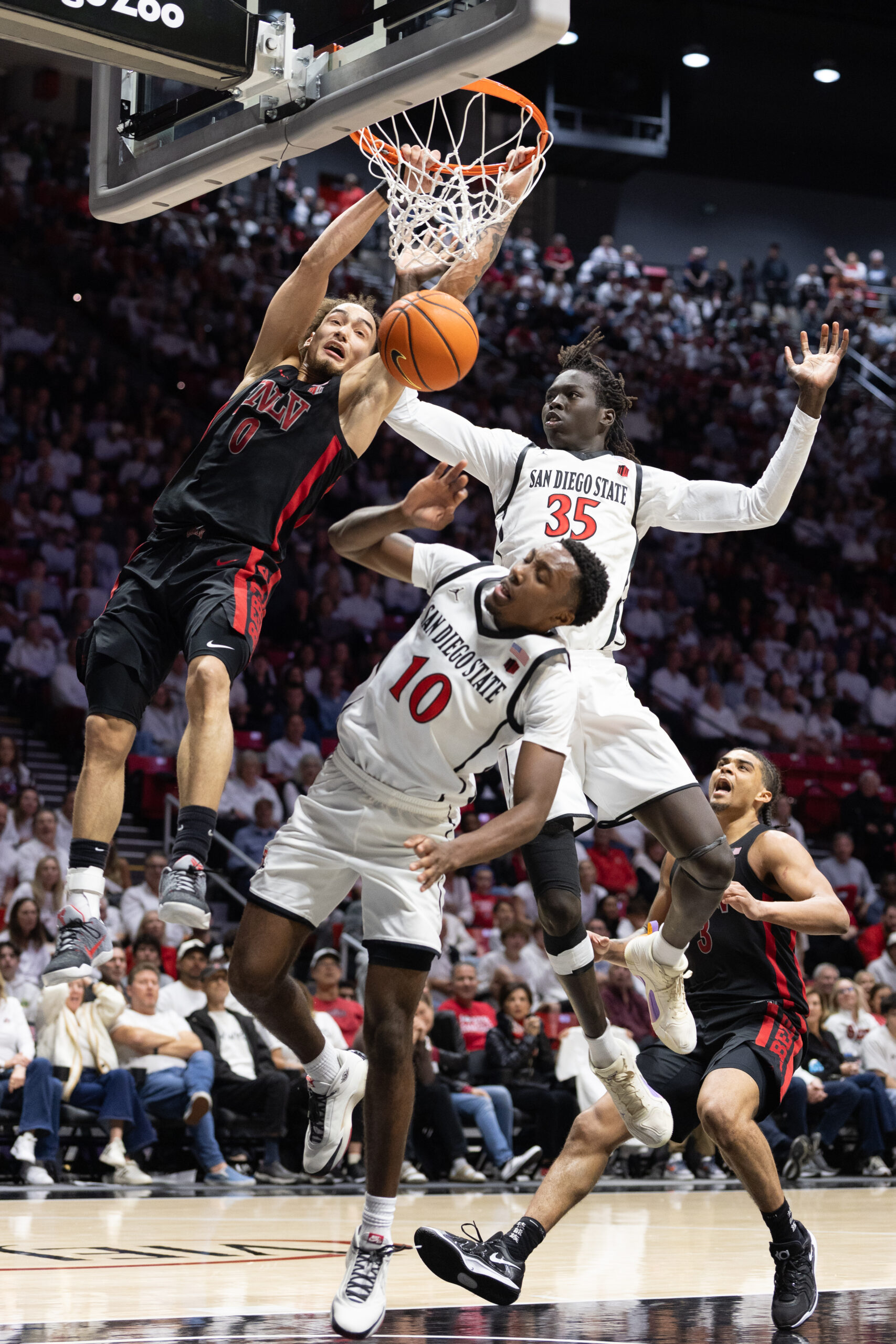 AZTECS AND REBELS SHOW OFFENSIVE FIREWORKS, BUT SDSU PREVAILS 89-86 IN BASKETBALL SEASON FINALE