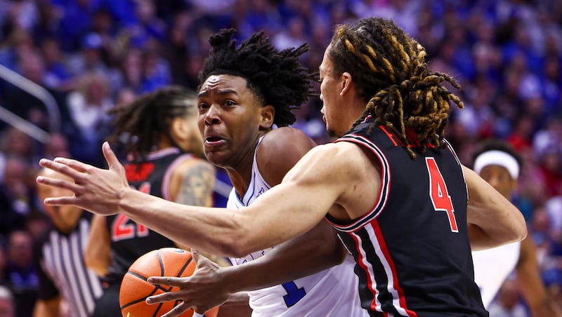 BYU guard Robert Wright III (1) drives to the basket against Houston during game at the Marriott Center in Provo on Saturday, Feb. 7, 2026. The two teams meet again tonight in the Big 12 tournament in Kansas City.