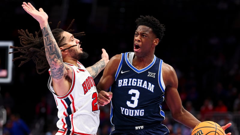 BYU forward AJ Dybantsa (3) collides with Houston Cougars guard Emanuel Sharp (21) during quarterfinal matchup in the Big 12 tournament at the T-Mobile Center in Kansas City, Mo., on Thursday, March 12, 2026.