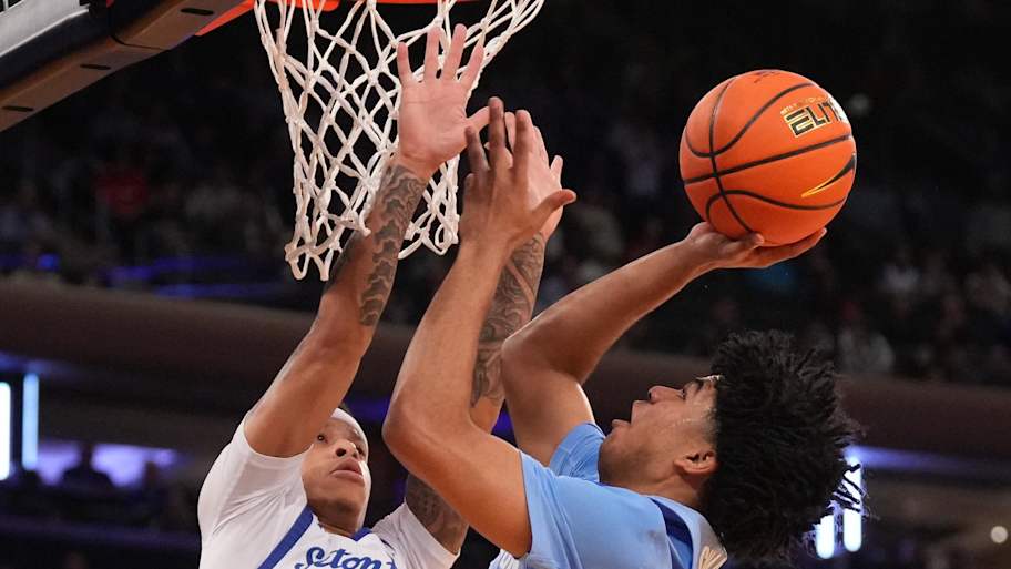 Creighton Bluejays guard Austin Swartz (1) shoots against Seton Hall Pirates guard Adam Clark (0).