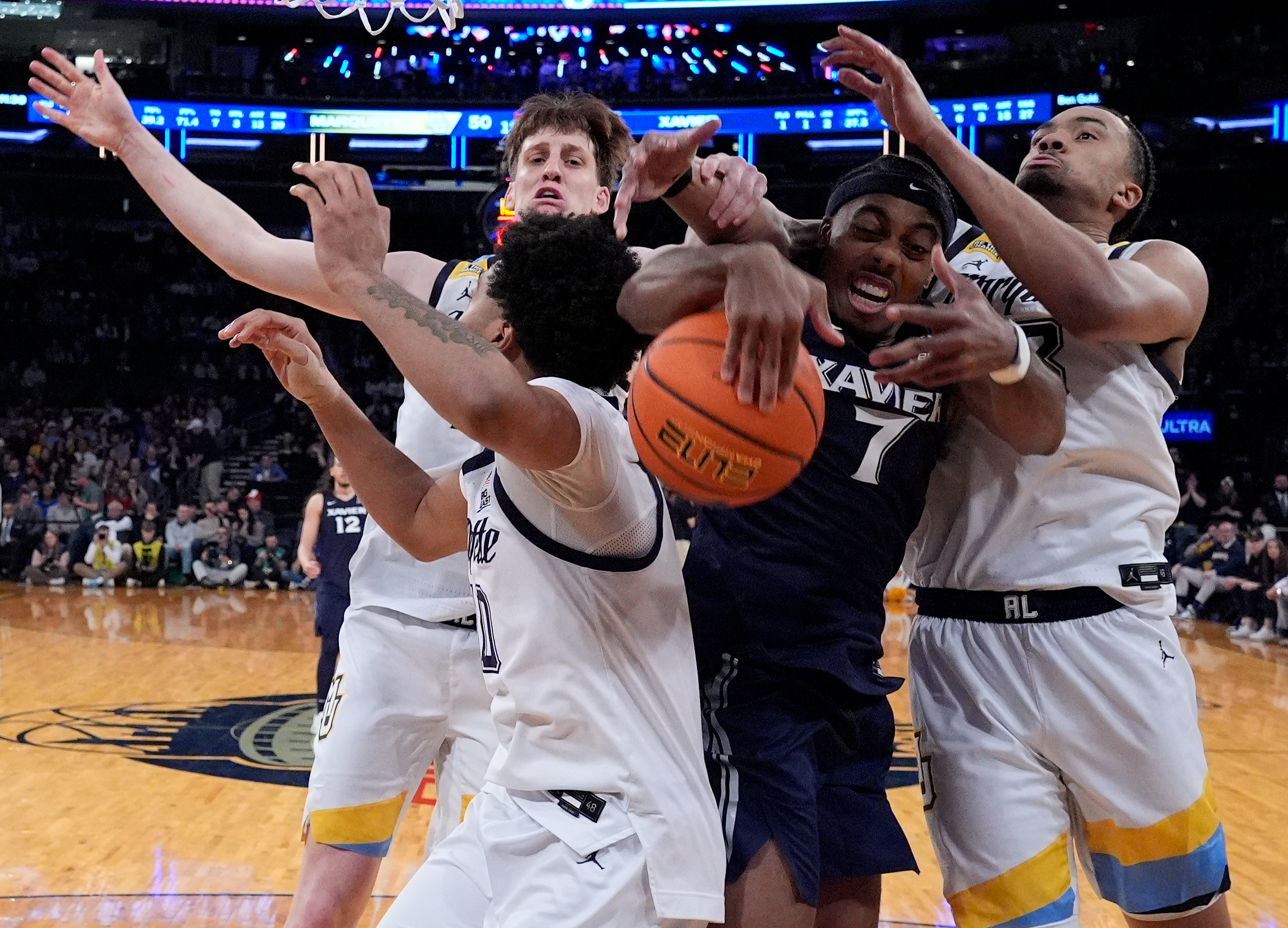 Mar 11, 2026; New York, NY, USA; Xavier Musketeers guard Isaiah Walker (7) goes for the ball against Marquette Golden Eagles during the second half at Madison Square Garden.