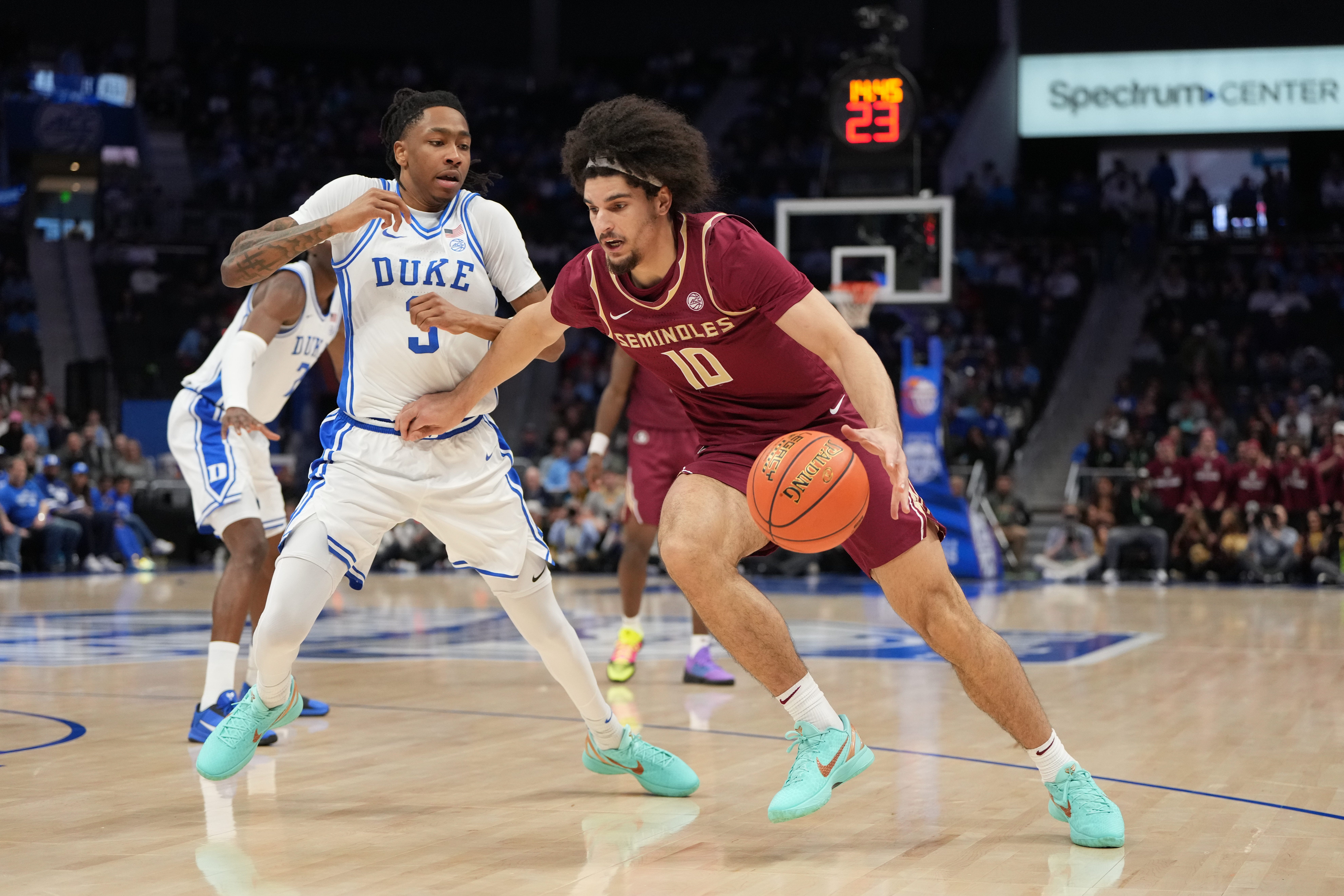 Mar 12, 2026; Charlotte, NC, USA; Florida State Seminoles guard Lajae Jones (10) with the ball as Duke Blue Devils guard Isaiah Evans (3) defends in the first half at Spectrum Center. Mandatory Credit: Bob Donnan-Imagn Images
