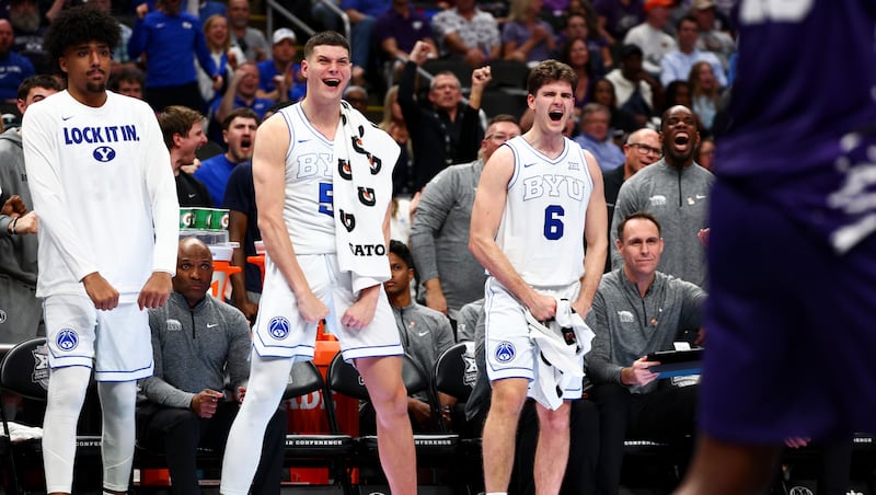 BYU forward Mihailo Boskovic (5) and guard Aleksej Kostić (6) celebrate on the bench after a BYU basket during the second half of the game against the Kansas State Wildcats during the 2026 Phillips 66 Big 12 Men's Basketball Tournament at the T-Mobile Center in Kansas City, Missouri, on Tuesday, March 10, 2026.