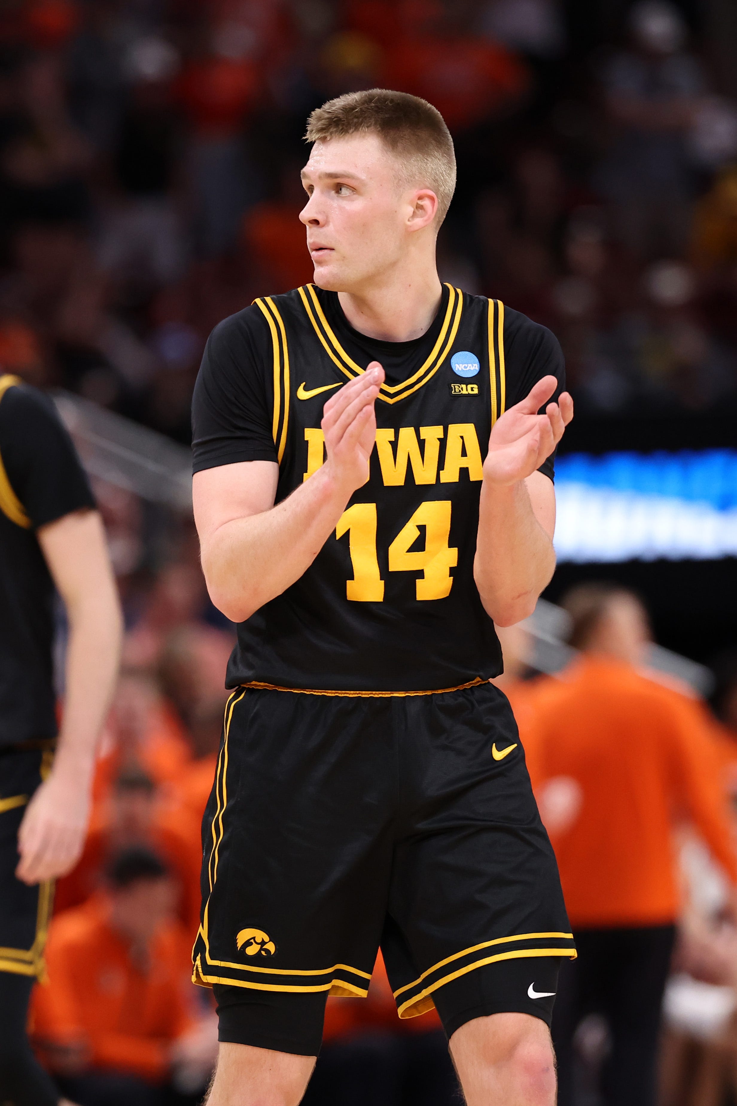 Iowa Hawkeyes guard Bennett Stirtz (14) reacts in the first half against the Illinois Fighting Illini during an Elite Eight game of the South Region of the men's 2026 NCAA Tournament at Toyota Center.