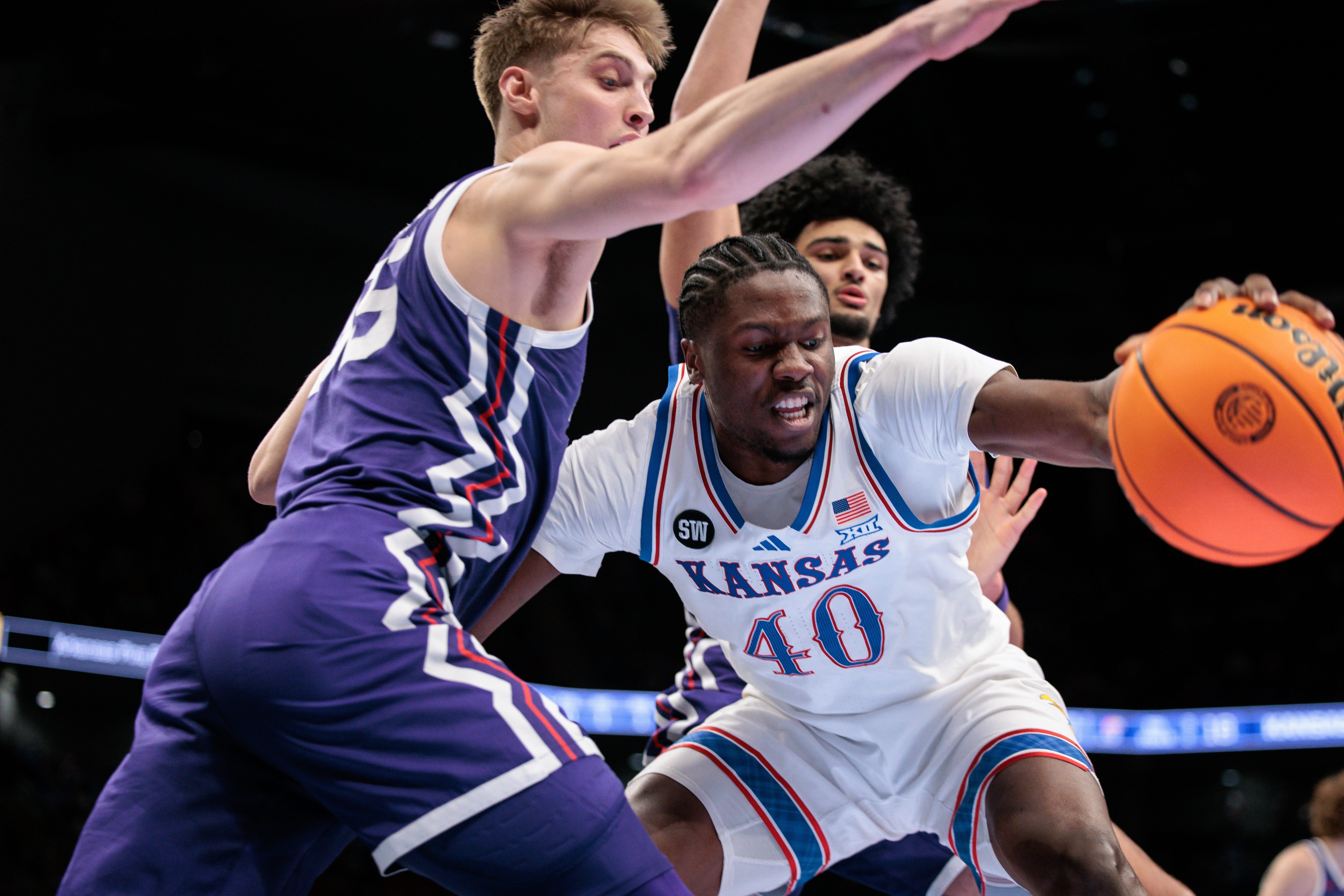March 12, 2026; Kansas City, MO; Kansas basketball forward Flory Bidunga (40) goes after a loose ball during the first half against TCU at T-Mobile Center.