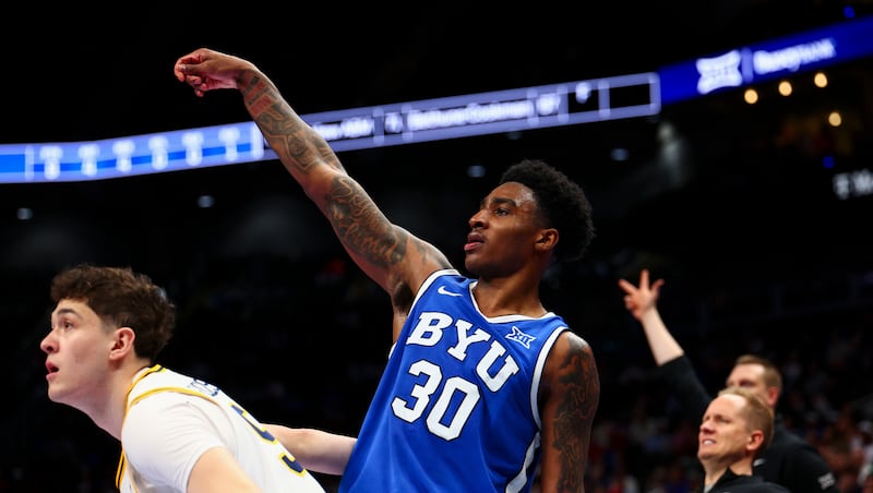 BYU guard Kennard Davis Jr. (30) watches his three-pointer fly during the second half of the game against the West Virginia Mountaineers in the second round of the 2026 Phillips 66 Big 12 Men's Basketball Tournament at the T-Mobile Center in Kansas City, Missouri, on Wednesday, March 11, 2026.